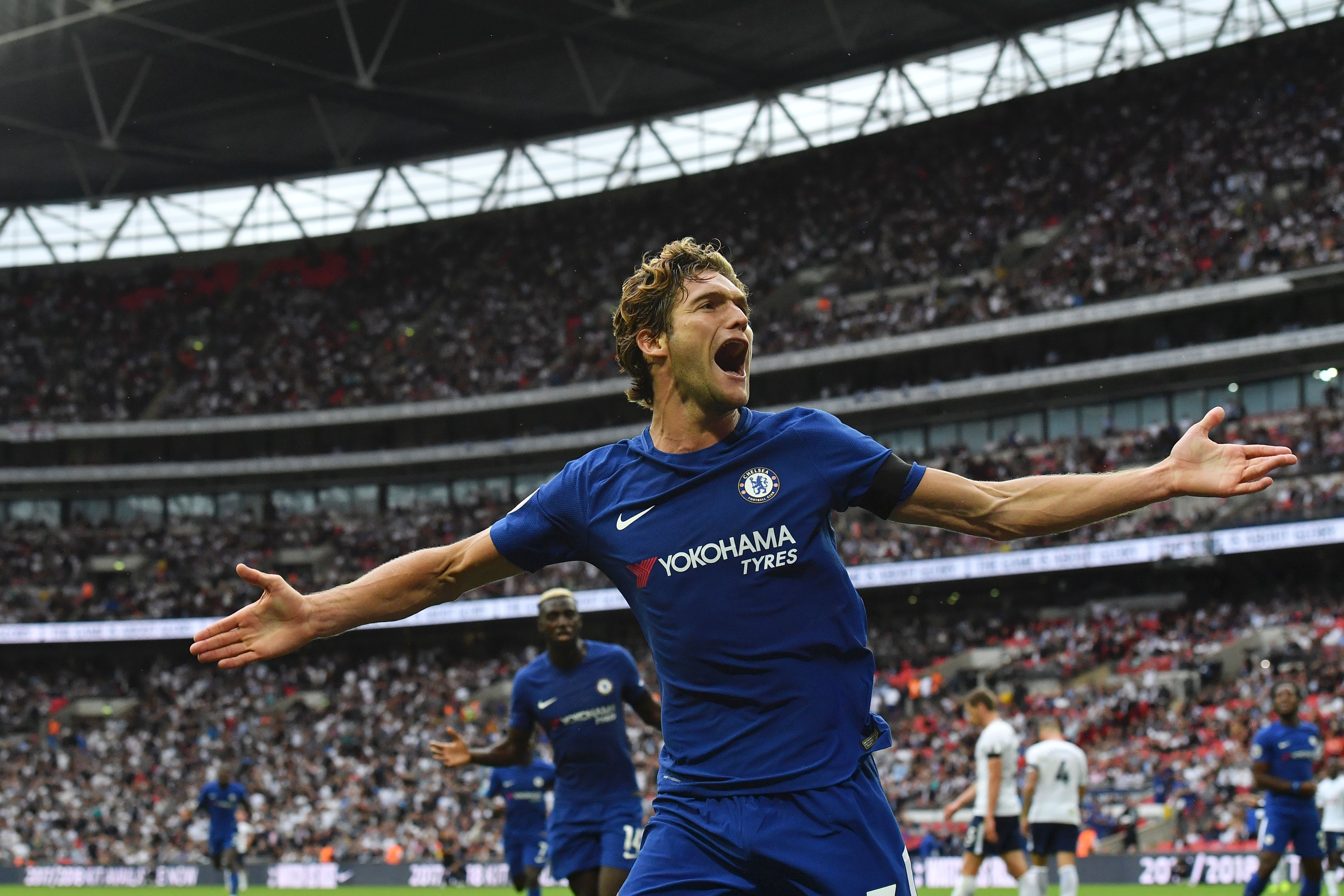 Chelsea's Spanish defender Marcos Alonso celebrates after he scored their second goal during the English Premier League football match between Tottenham Hotspur and Chelsea at Wembley Stadium in London, on August 20, 2017. / AFP PHOTO / Ben STANSALL / RESTRICTED TO EDITORIAL USE. No use with unauthorized audio, video, data, fixture lists, club/league logos or 'live' services. Online in-match use limited to 75 images, no video emulation. No use in betting, games or single club/league/player publications.  /         (Photo credit should read BEN STANSALL/AFP/Getty Images)