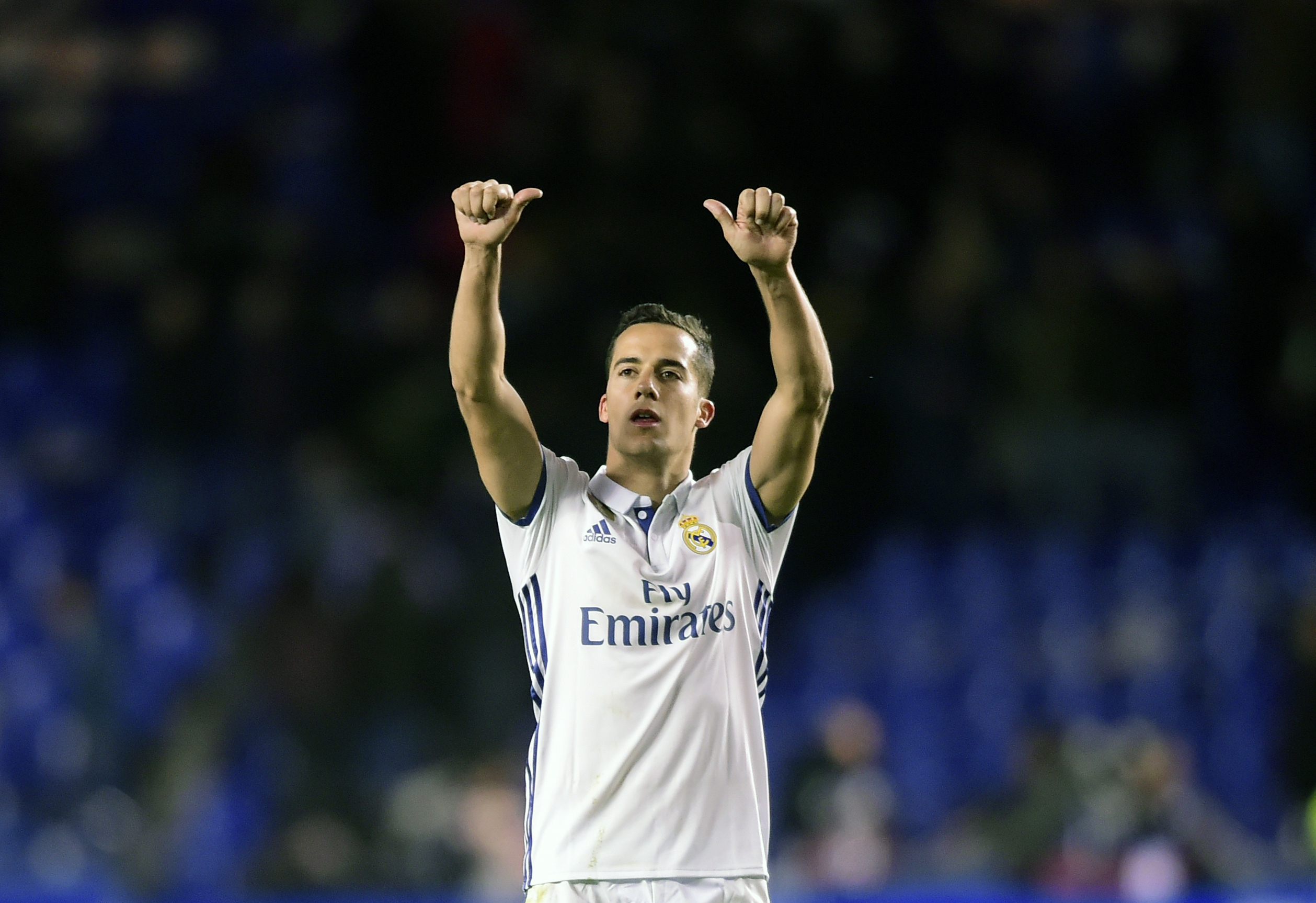 Real Madrid's midfielder Lucas Vazquez celebrates at the end of the  Spanish league football match RC Deportivo vs Real Madrid CF at the Municipal de Riazor stadium in La Coruna on April 26, 2017. / AFP PHOTO / MIGUEL RIOPA        (Photo credit should read MIGUEL RIOPA/AFP/Getty Images)