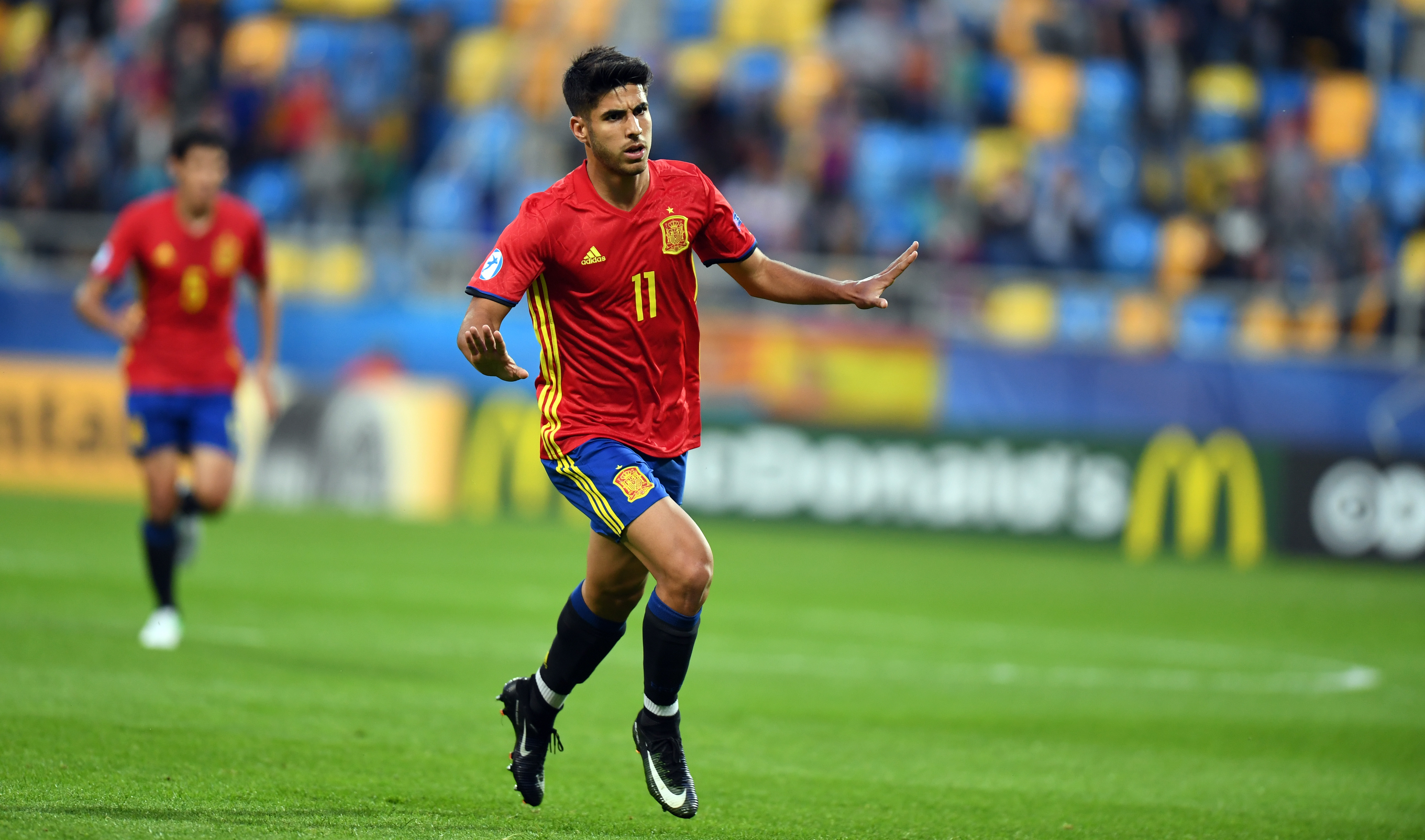 Spain's midfielder Marco Asensio celebrate scoring during the UEFA U-21 European Championship Group B football match Spain v FYR Macedonia on June 17, 2017 in Gdynia, Poland. / AFP PHOTO / Maciej GILLERT        (Photo credit should read MACIEJ GILLERT/AFP/Getty Images)