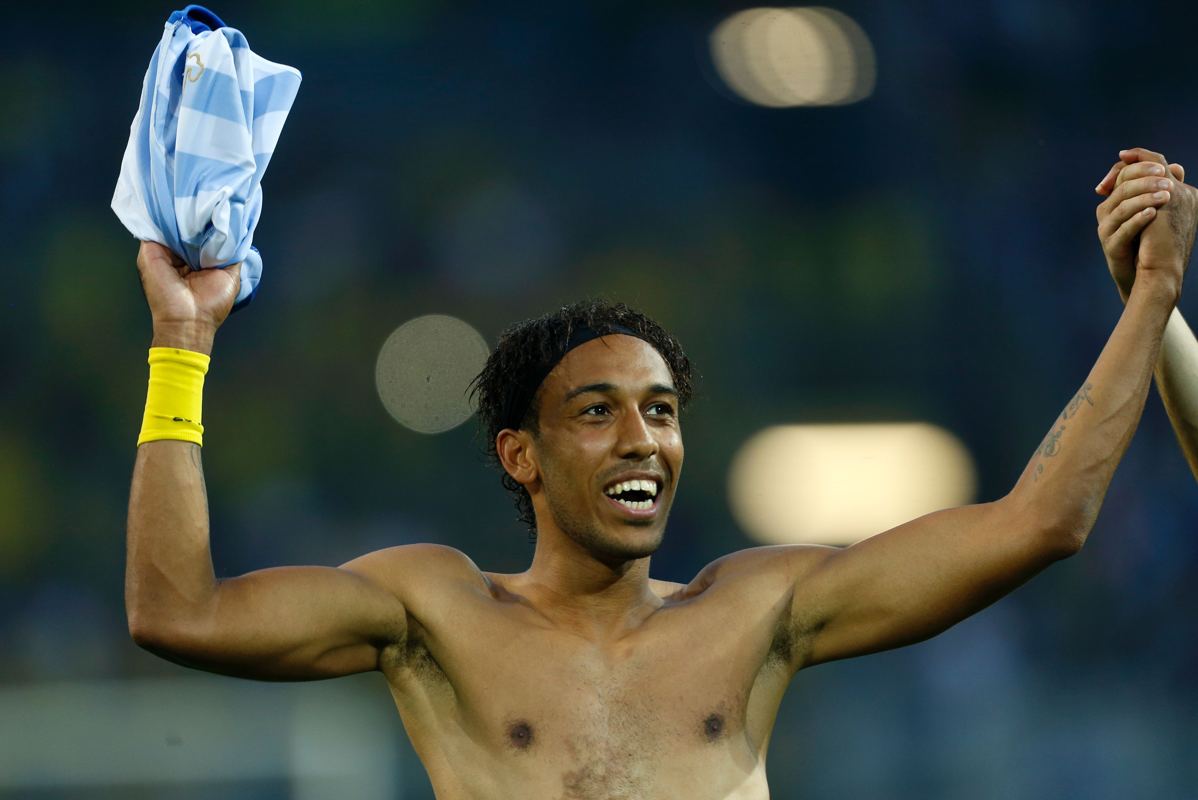 Dortmund's Gabonese forward Pierre-Emerick Aubameyang celebrates after the German First division Bundesliga football match between Borussia Dortmund and Hertha Berlin in Dortmund, western Germany, on August 26, 2017. / AFP PHOTO / INA FASSBENDER / RESTRICTIONS: DURING MATCH TIME: DFL RULES TO LIMIT THE ONLINE USAGE TO 15 PICTURES PER MATCH AND FORBID IMAGE SEQUENCES TO SIMULATE VIDEO. == RESTRICTED TO EDITORIAL USE == FOR FURTHER QUERIES PLEASE CONTACT DFL DIRECTLY AT + 49 69 650050        (Photo credit should read INA FASSBENDER/AFP/Getty Images)