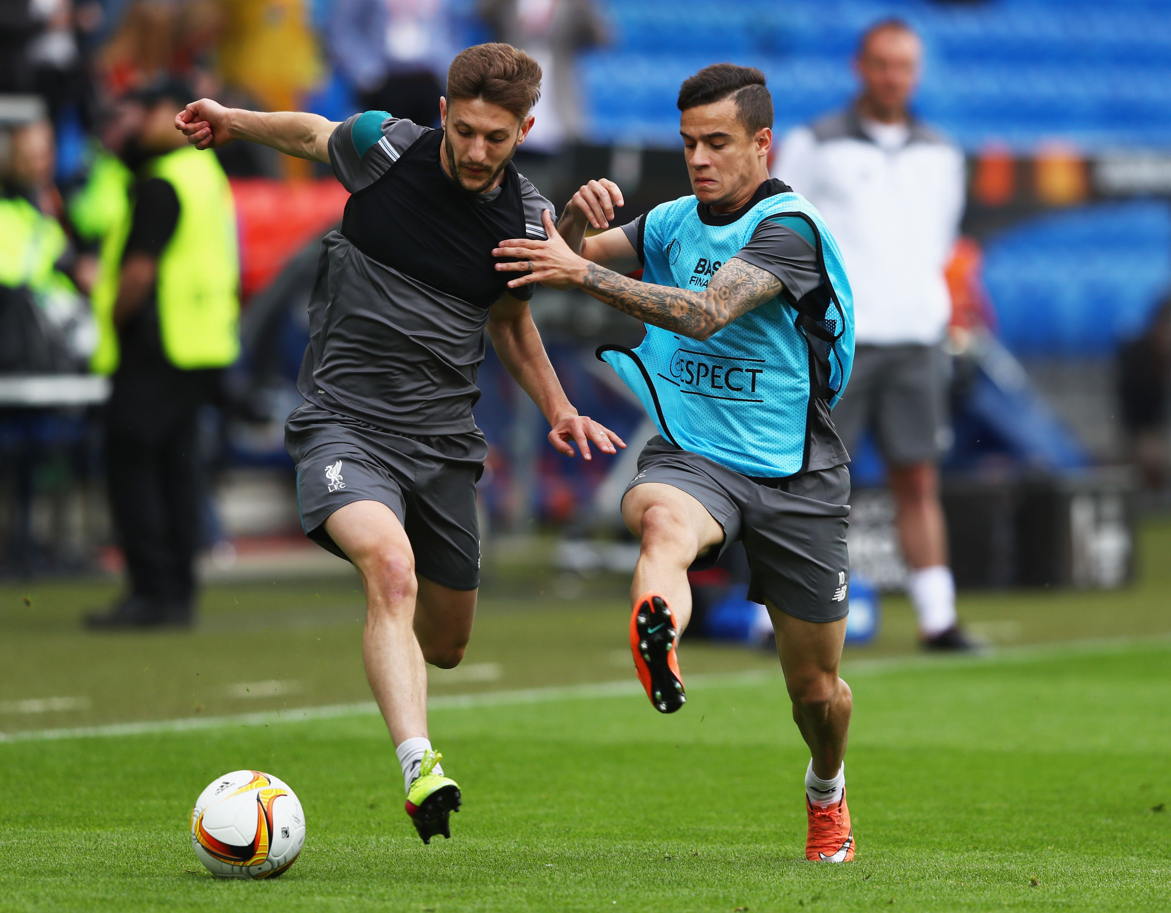 BASEL, SWITZERLAND - MAY 17: Adam Lallana of Liverpool challenges for the ball with Philippe Coutinho during a Liverpool training session on the eve of the UEFA Europa League Final against Sevilla at St. Jakob-Park on May 17, 2016 in Basel, Switzerland.  (Photo by Michael Steele/Getty Images)