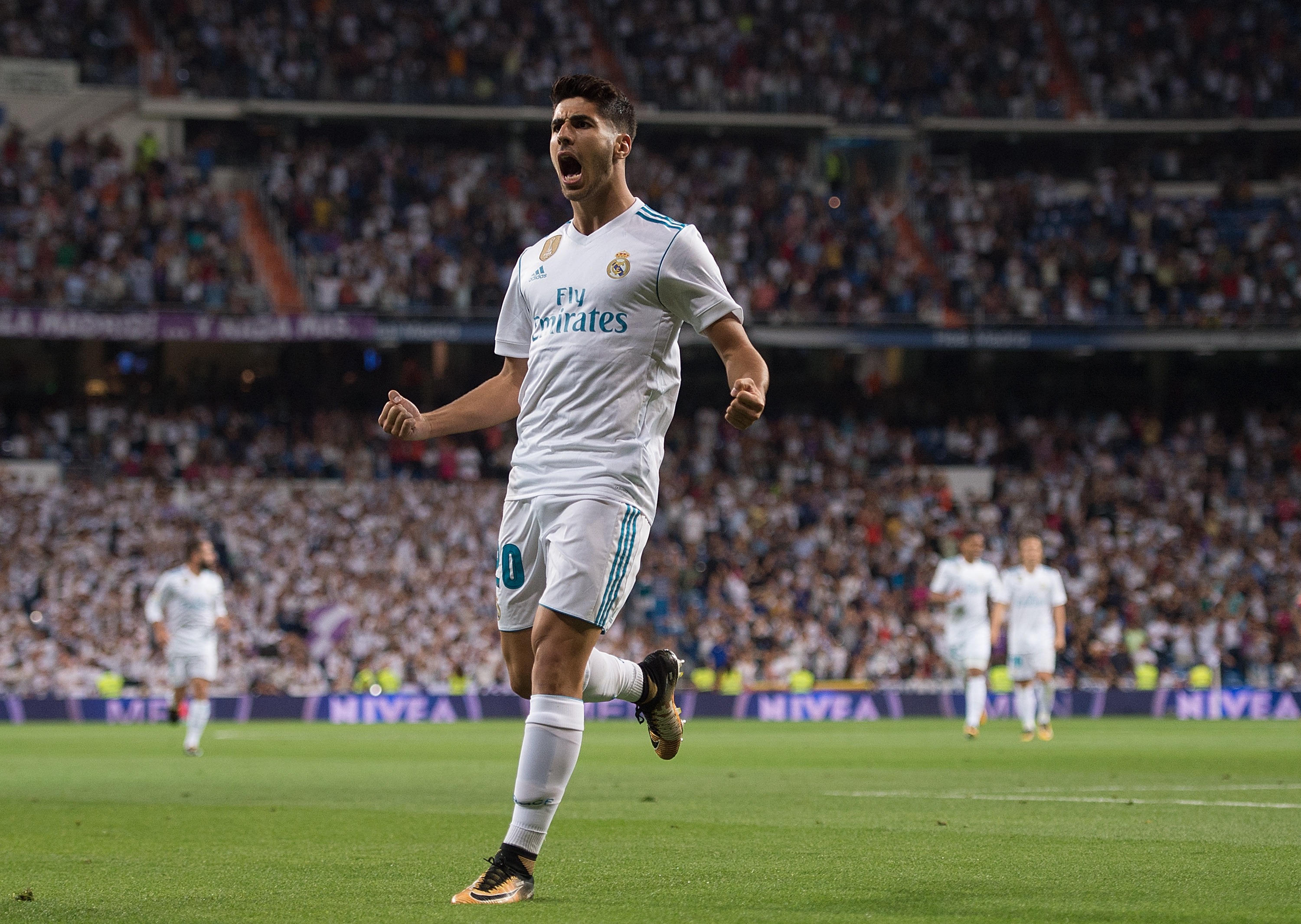 MADRID, SPAIN - AUGUST 27: Marco Asensio of Real Madrid CF celebrates after scoring his teamÕs 1st goal during the La Liga match between Real Madrid CF and Valencia CF at Estadio Santiago Bernabeu on August 27, 2017 in Madrid, Spain . (Photo by Denis Doyle/Getty Images)