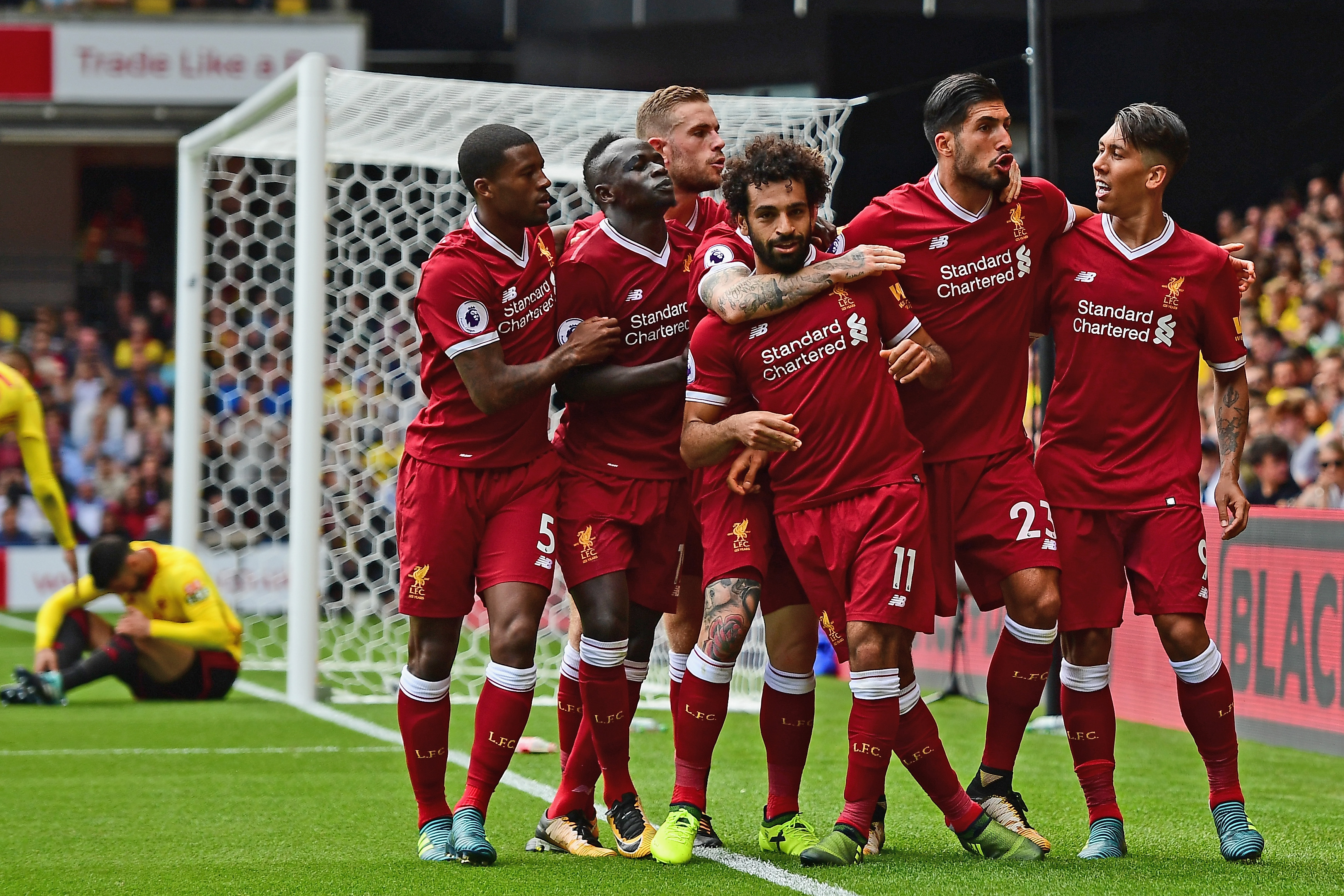 WATFORD, ENGLAND - AUGUST 12: Mohamed Salah of Liverpool celebrates scoring his sides third goal with his Liverpool team mates during the Premier League match between Watford and Liverpool at Vicarage Road on August 12, 2017 in Watford, England.  (Photo by Alex Broadway/Getty Images)