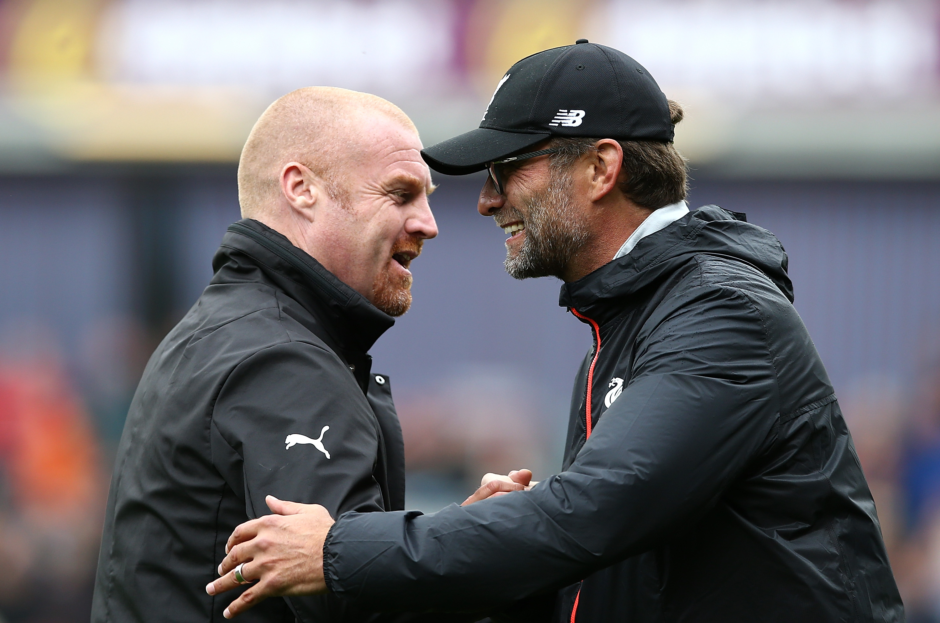 BURNLEY, ENGLAND - AUGUST 20:  Manager of Liverpool Jurgen Klopp and Sean Dyche, Manager of Burnley embrace ahead of kick off during the Premier League match between Burnley and Liverpool at Turf Moor on August 20, 2016 in Burnley, England.  (Photo by Jan Kruger/Getty Images)
