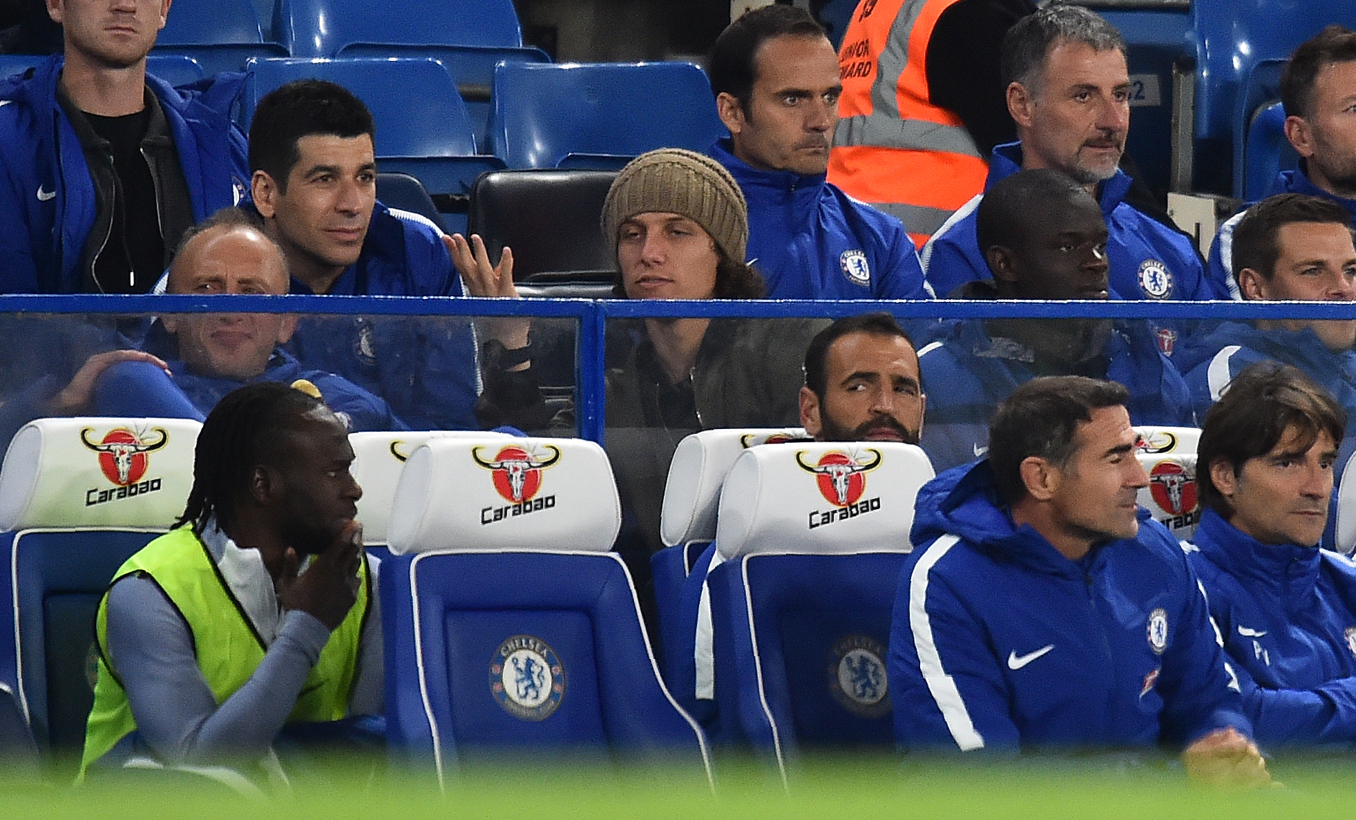 Chelsea's Brazilian defender David Luiz (C) gestures as he watches from the bench during the English League Cup third round football match between Chelsea and Nottingham Forest at Stamford Bridge in London on September 20, 2017.
Chelsea won the match 5-1. / AFP PHOTO / Glyn KIRK / RESTRICTED TO EDITORIAL USE. No use with unauthorized audio, video, data, fixture lists, club/league logos or 'live' services. Online in-match use limited to 75 images, no video emulation. No use in betting, games or single club/league/player publications.  /         (Photo credit should read GLYN KIRK/AFP/Getty Images)