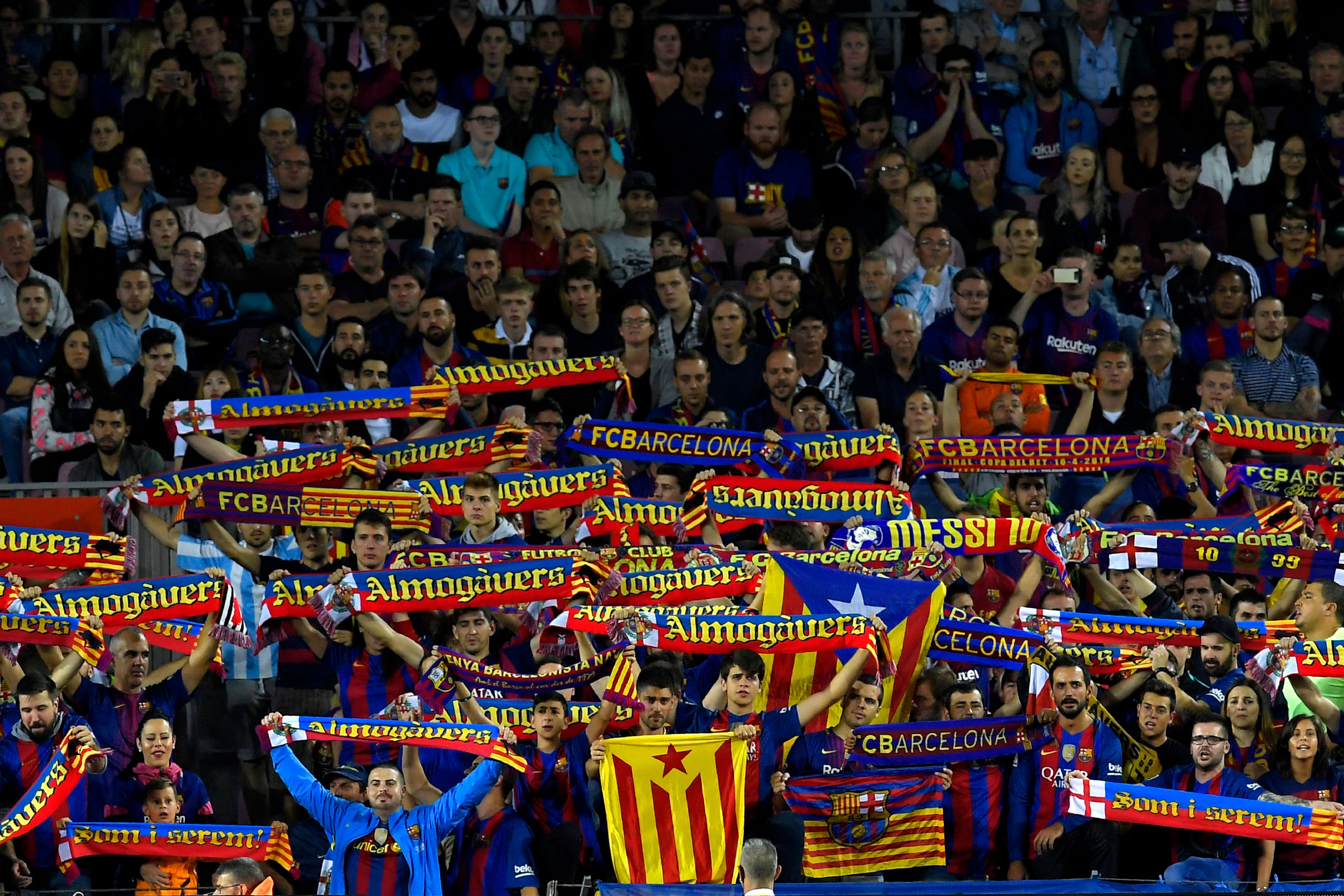 Barcelona's supporters cheer their team during the Spanish Liga football match Barcelona vs Espanyol at the Camp Nou stadium in Barcelona on September 9, 2017. / AFP PHOTO / LLUIS GENE        (Photo credit should read LLUIS GENE/AFP/Getty Images)