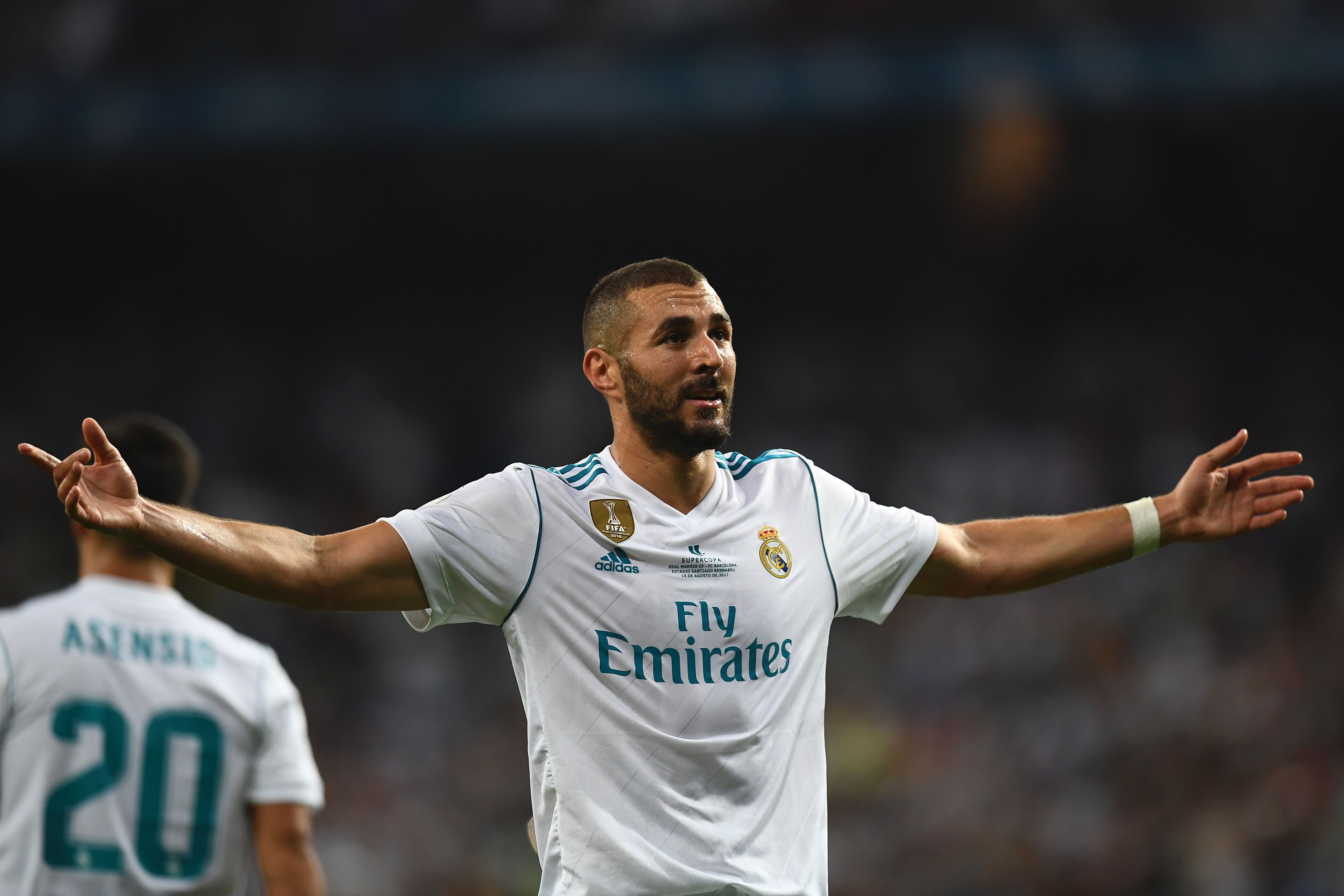 Real Madrid's French forward Karim Benzema celebrates after scoring their second goal during the second leg of the Spanish Supercup football match Real Madrid vs FC Barcelona at the Santiago Bernabeu stadium in Madrid, on August 16, 2017. / AFP PHOTO / GABRIEL BOUYS        (Photo credit should read GABRIEL BOUYS/AFP/Getty Images)
