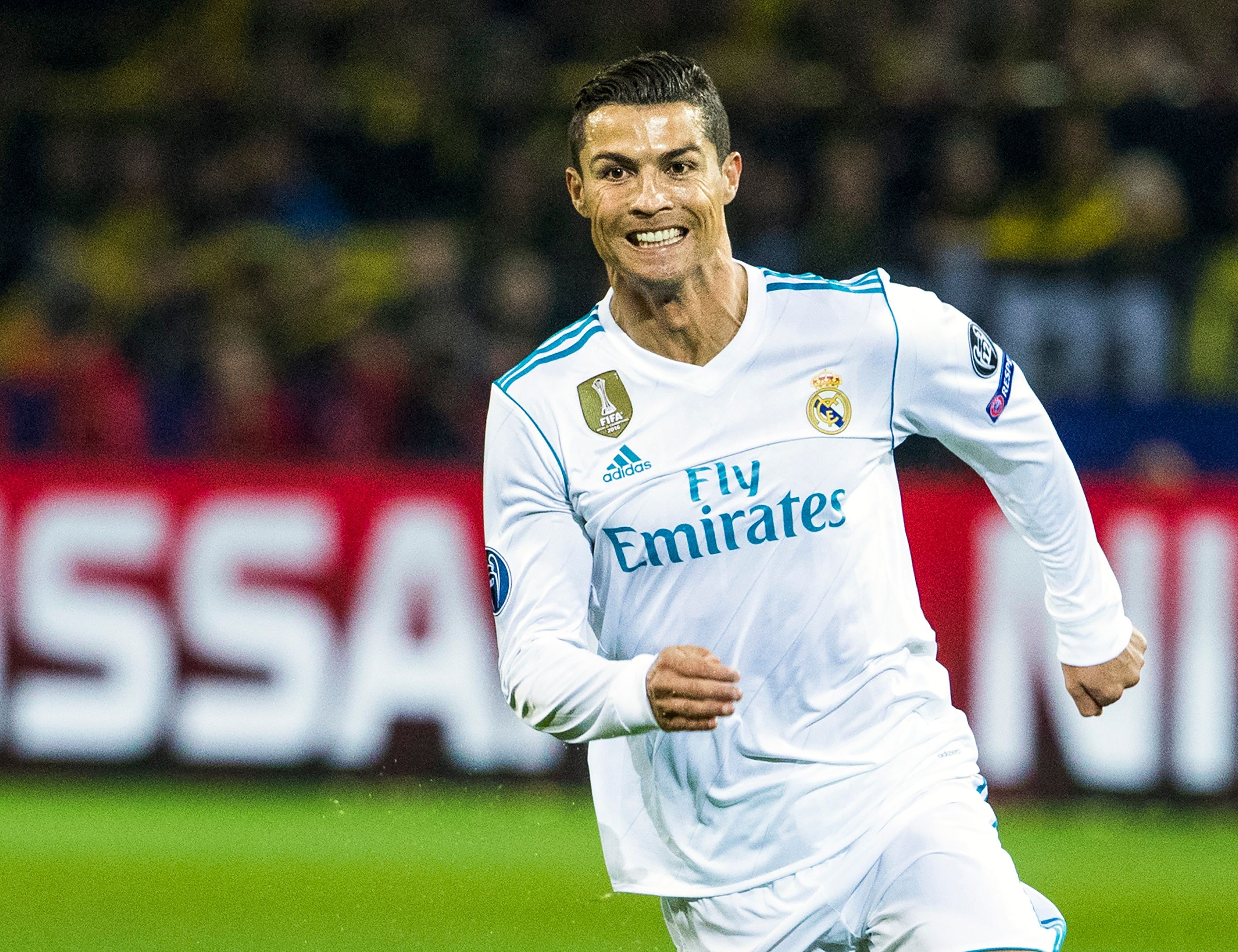 Real Madrid's Portuguese forward Ronaldo runs with the ball during the UEFA Champions League Group H football match BVB Borussia Dortmund v Real Madrid in Dortmund, western Germany on September 26, 2017. / AFP PHOTO / Odd ANDERSEN        (Photo credit should read ODD ANDERSEN/AFP/Getty Images)