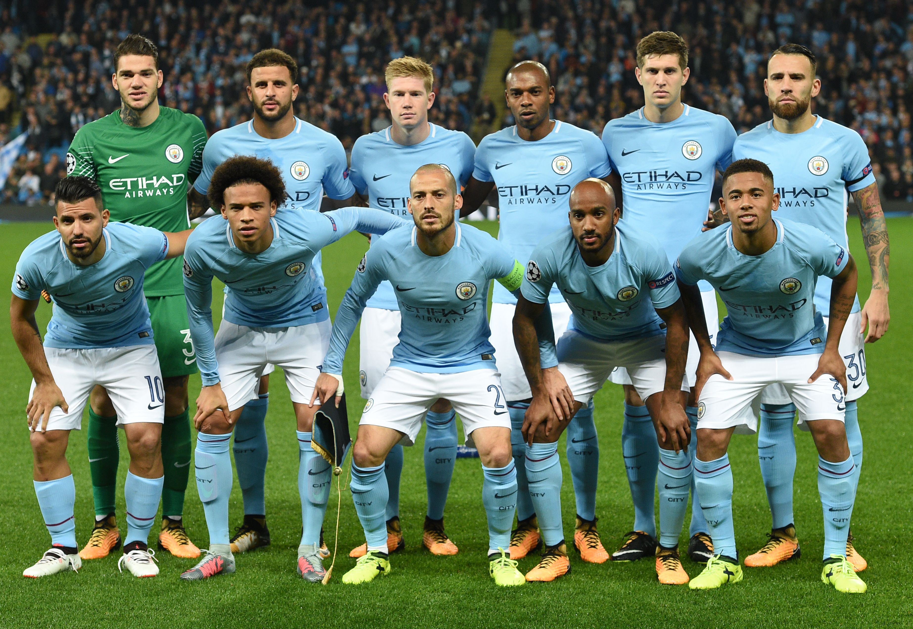 (Back row LtoR) Manchester City's Brazilian goalkeeper Ederson, Manchester City's English defender Kyle Walker, Manchester City's Belgian midfielder Kevin De Bruyne, Manchester City's Brazilian midfielder Fernandinho, Manchester City's English defender John Stones and Manchester City's Argentinian defender Nicolas Otamendi, and (Front row LtoR) Manchester City's Argentinian striker Sergio Aguero, Manchester City's German midfielder Leroy Sane, Manchester City's Spanish midfielder David Silva, Manchester City's English midfielder Fabian Delph and Manchester City's Brazilian striker Gabriel Jesus, pose for a photo ahead of the Group F football match between Manchester City and Shakhtar Donetsk at the Etihad Stadium in Manchester, north west England, on September 26, 2017. / AFP PHOTO / Oli SCARFF        (Photo credit should read OLI SCARFF/AFP/Getty Images)