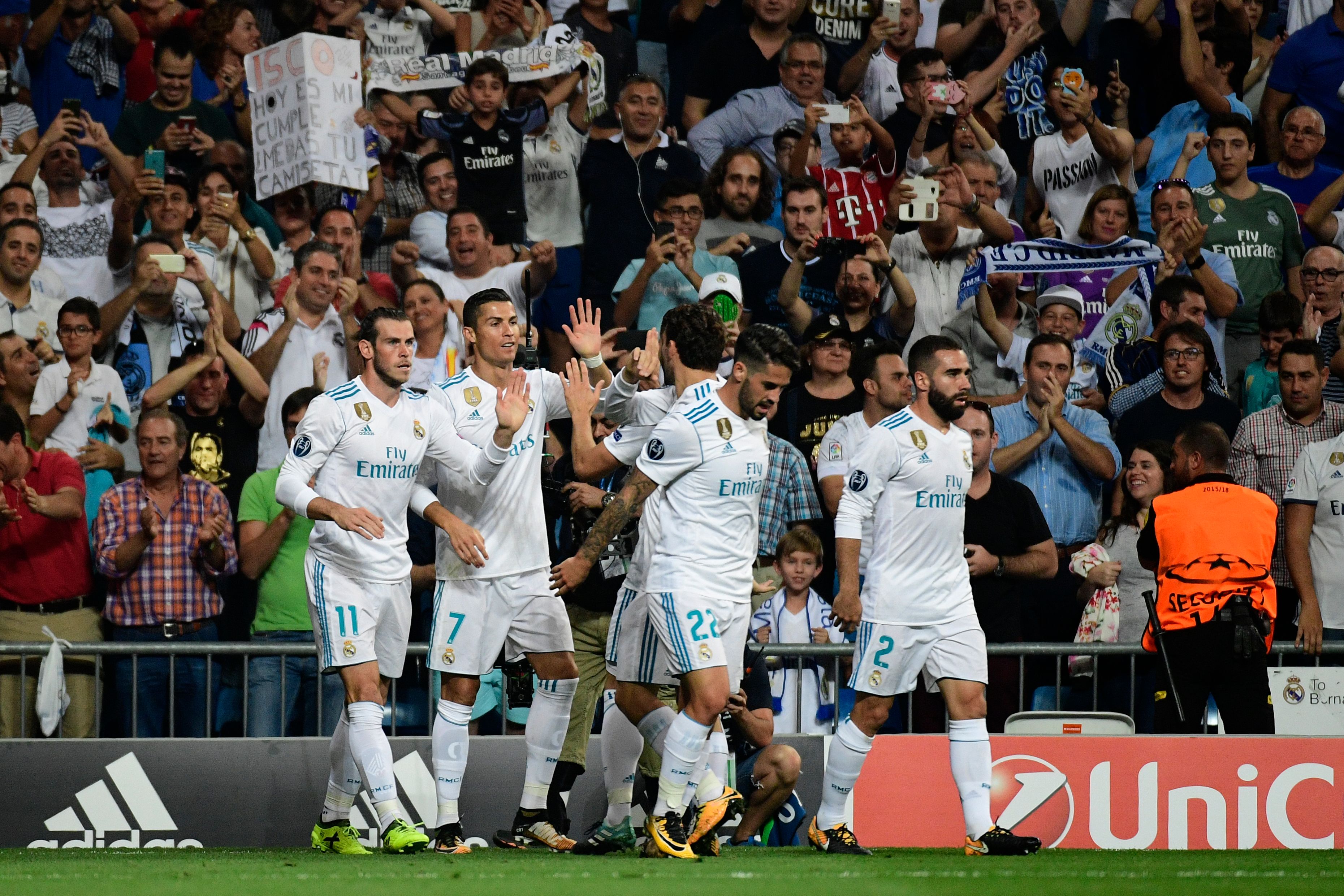 Real Madrid's forward from Portugal Cristiano Ronaldo (2ndL) celebrates with teammates after scoring during the UEFA Champions League football match Real Madrid CF vs APOEL FC at the Santiago Bernabeu stadium in Madrid on September 13, 2017. / AFP PHOTO / PIERRE-PHILIPPE MARCOU        (Photo credit should read PIERRE-PHILIPPE MARCOU/AFP/Getty Images)