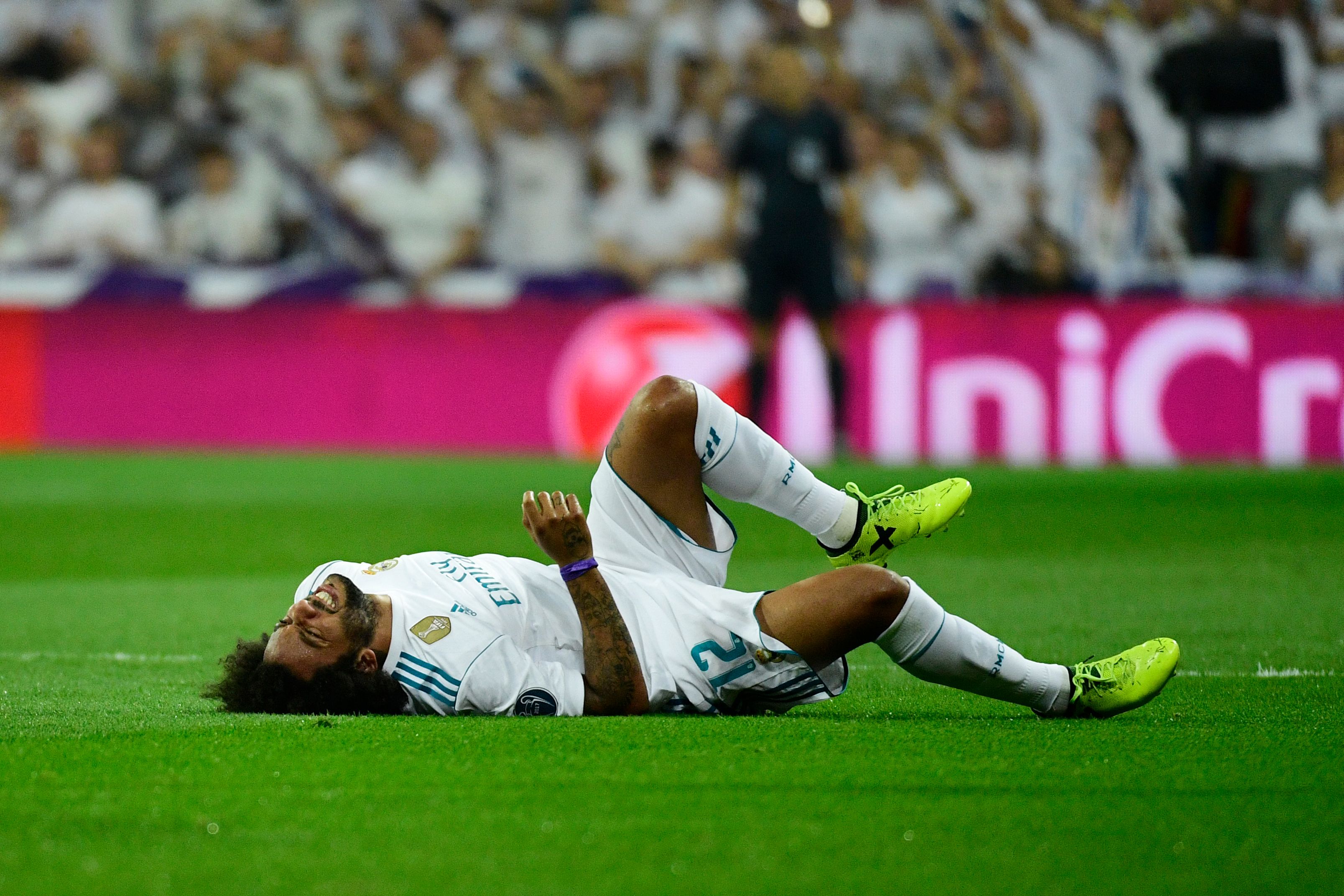 Real Madrid's defender from Brazil Marcelo gestures as he lies on the pitch during the UEFA Champions League football match Real Madrid CF vs APOEL FC at the Santiago Bernabeu stadium in Madrid on September 13, 2017. / AFP PHOTO / PIERRE-PHILIPPE MARCOU        (Photo credit should read PIERRE-PHILIPPE MARCOU/AFP/Getty Images)