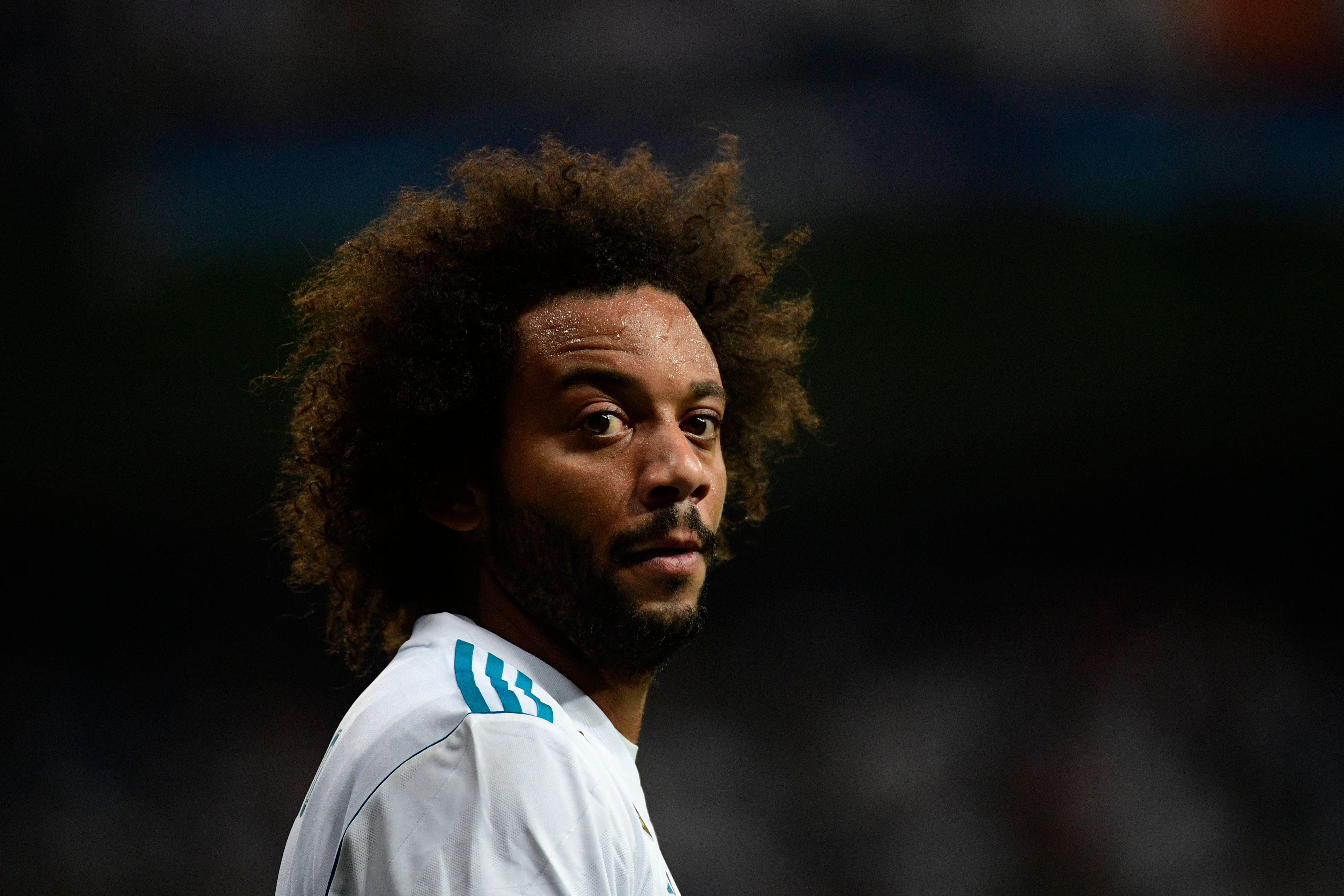 Real Madrid's defender from Brazil Marcelo looks on during the UEFA Champions League football match Real Madrid CF vs APOEL FC at the Santiago Bernabeu stadium in Madrid on September 13, 2017. / AFP PHOTO / PIERRE-PHILIPPE MARCOU        (Photo credit should read PIERRE-PHILIPPE MARCOU/AFP/Getty Images)