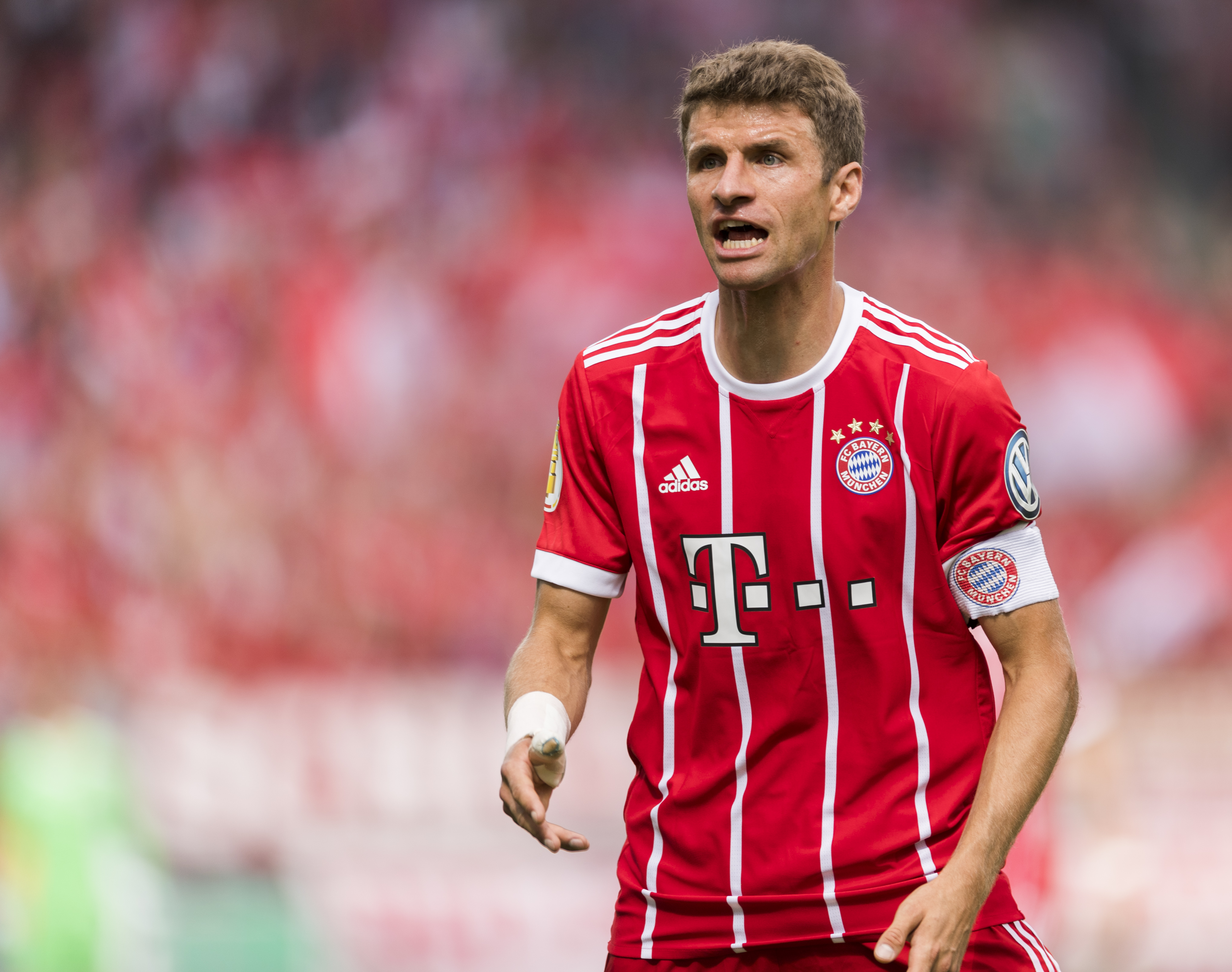 Munich's forward Thomas Mueller reacts during the German football Cup DFB Pokal first round match between German third division football club Chemnitzer FC and German first division football club FC Bayern Munich in Chemnitz eastern Germany, on August 12, 2017.  / AFP PHOTO / ROBERT MICHAEL / RESTRICTIONS: ACCORDING TO DFB RULES IMAGE SEQUENCES TO SIMULATE VIDEO IS NOT ALLOWED DURING MATCH TIME. MOBILE (MMS) USE IS NOT ALLOWED DURING AND FOR FURTHER TWO HOURS AFTER THE MATCH. == RESTRICTED TO EDITORIAL USE == FOR MORE INFORMATION CONTACT DFB DIRECTLY AT +49 69 67880

 /         (Photo credit should read ROBERT MICHAEL/AFP/Getty Images)