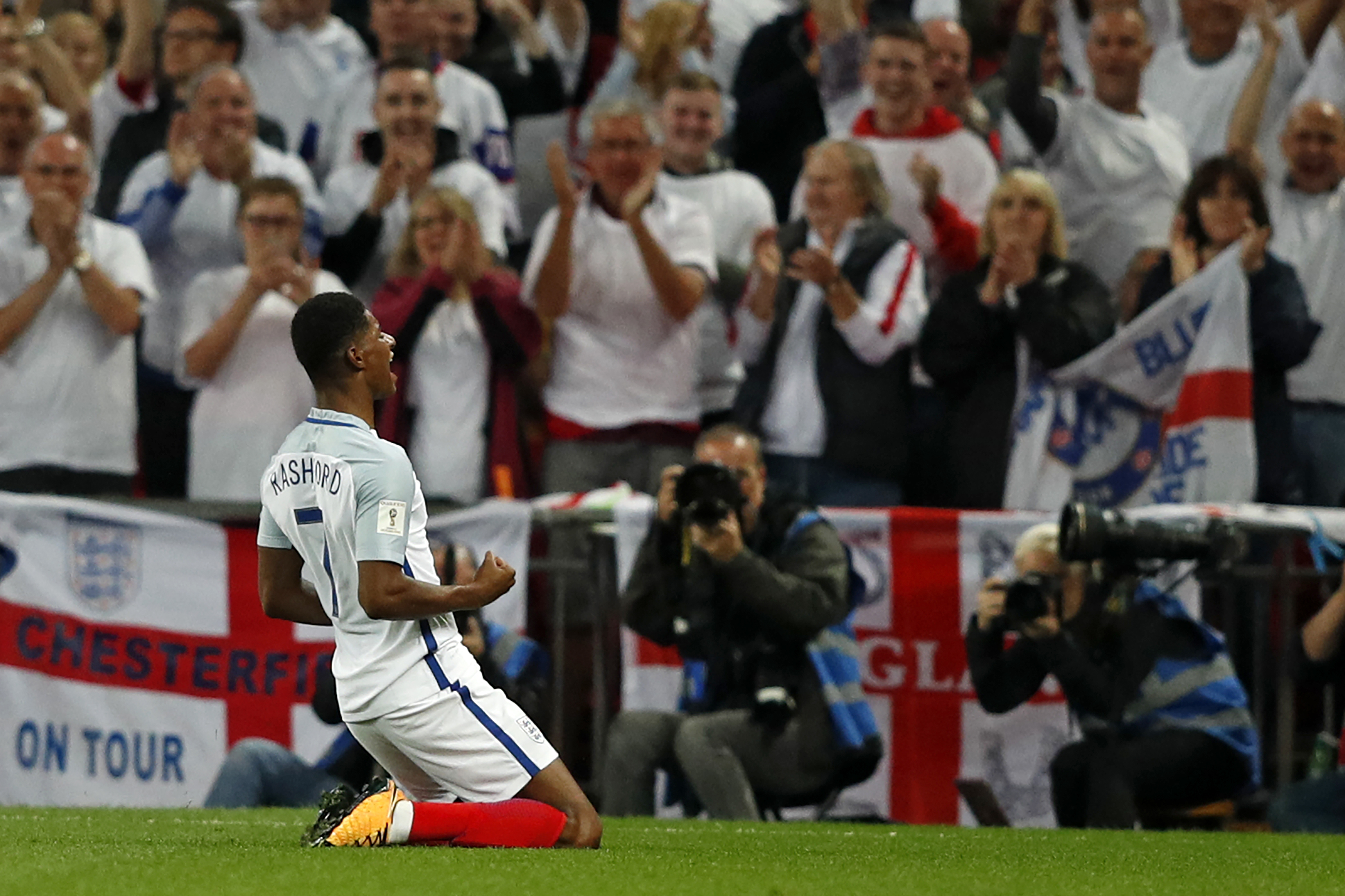 England's striker Marcus Rashford celebrates scoring England's second goal during the World Cup 2018 qualification football match between England and Slovakia at Wembley Stadium in London on September 4, 2017.  / AFP PHOTO / Adrian DENNIS / NOT FOR MARKETING OR ADVERTISING USE / RESTRICTED TO EDITORIAL USE
        (Photo credit should read ADRIAN DENNIS/AFP/Getty Images)