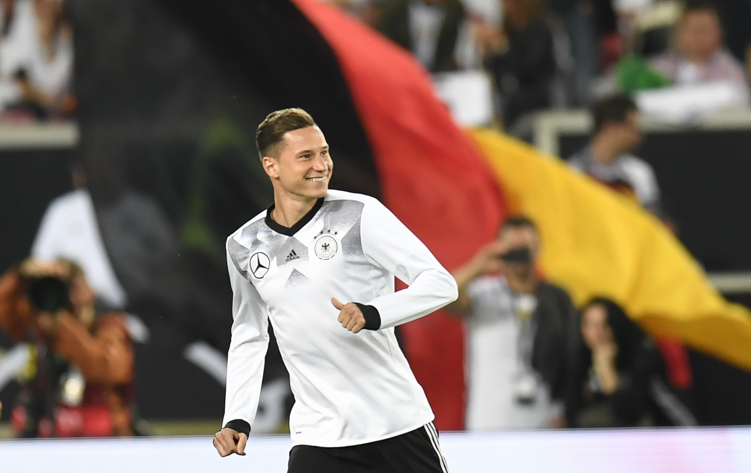 Germany's midfielder Julian Draxler warm up prior to the FIFA World Cup 2018 qualification match between Germany and Norway in the south German city of Stuttgart on September 4, 2017. / AFP PHOTO / THOMAS KIENZLE        (Photo credit should read THOMAS KIENZLE/AFP/Getty Images)