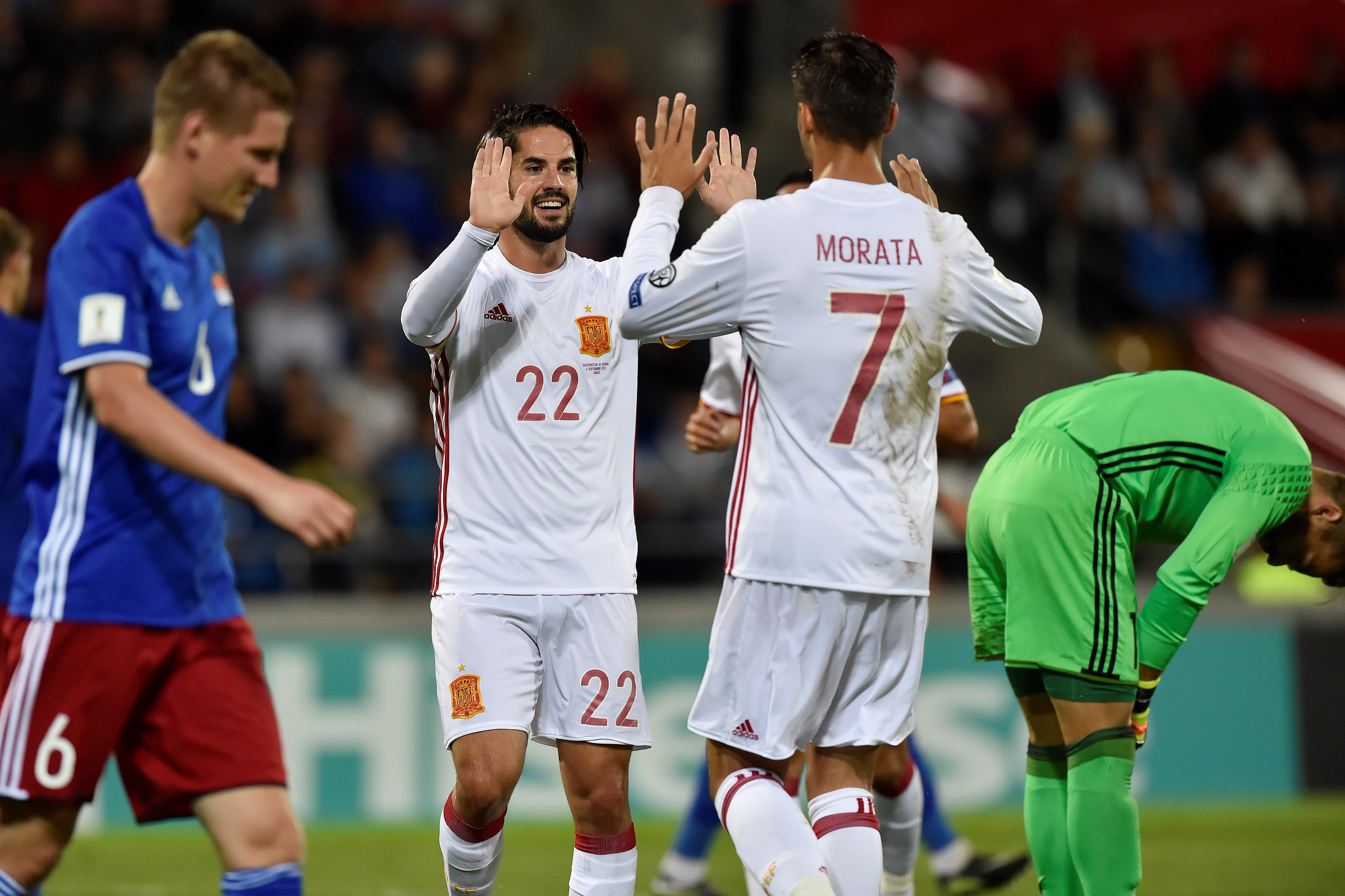 Spain's Isco ((C)) celebrates with teammate  Alvaro Morata (2nd R) after scoring a goal during the FIFA World Cup 2018 qualification football match between Liechtenstein and Spain on September 5, 2017 in Vaduz. / AFP PHOTO / Michael Buholzer        (Photo credit should read MICHAEL BUHOLZER/AFP/Getty Images)