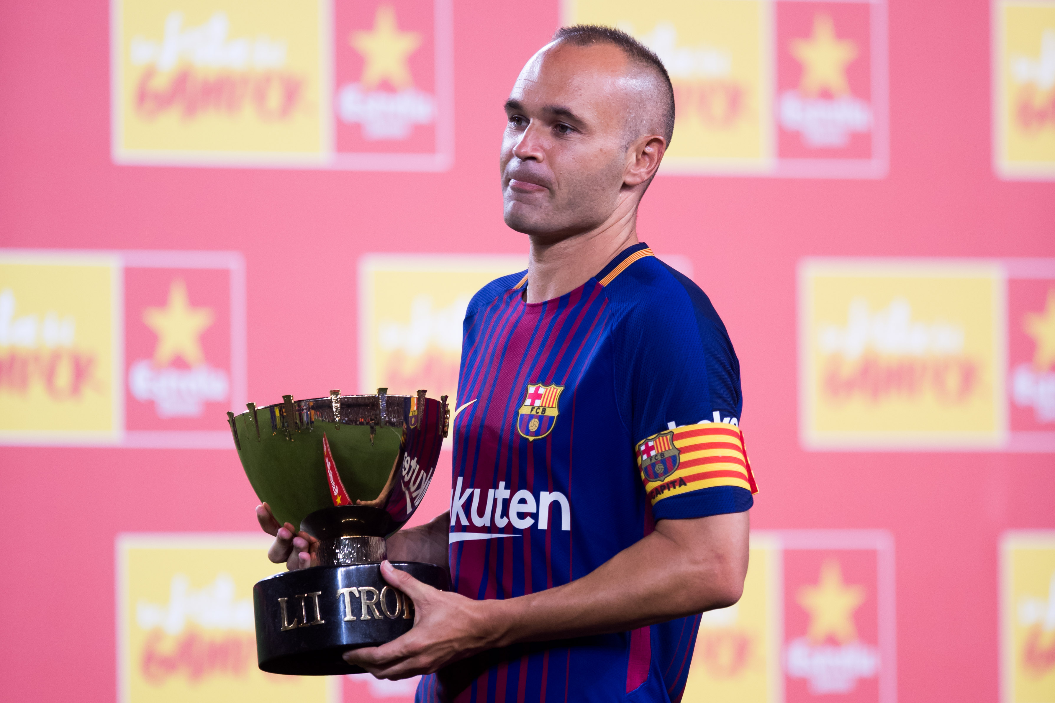 BARCELONA, SPAIN - AUGUST 07: Andres Iniesta of FC Barcelona holds the trophy after the Joan Gamper Trophy match between FC Barcelona and Chapecoense at Camp Nou stadium on August 7, 2017 in Barcelona, Spain. (Photo by Alex Caparros/Getty Images)