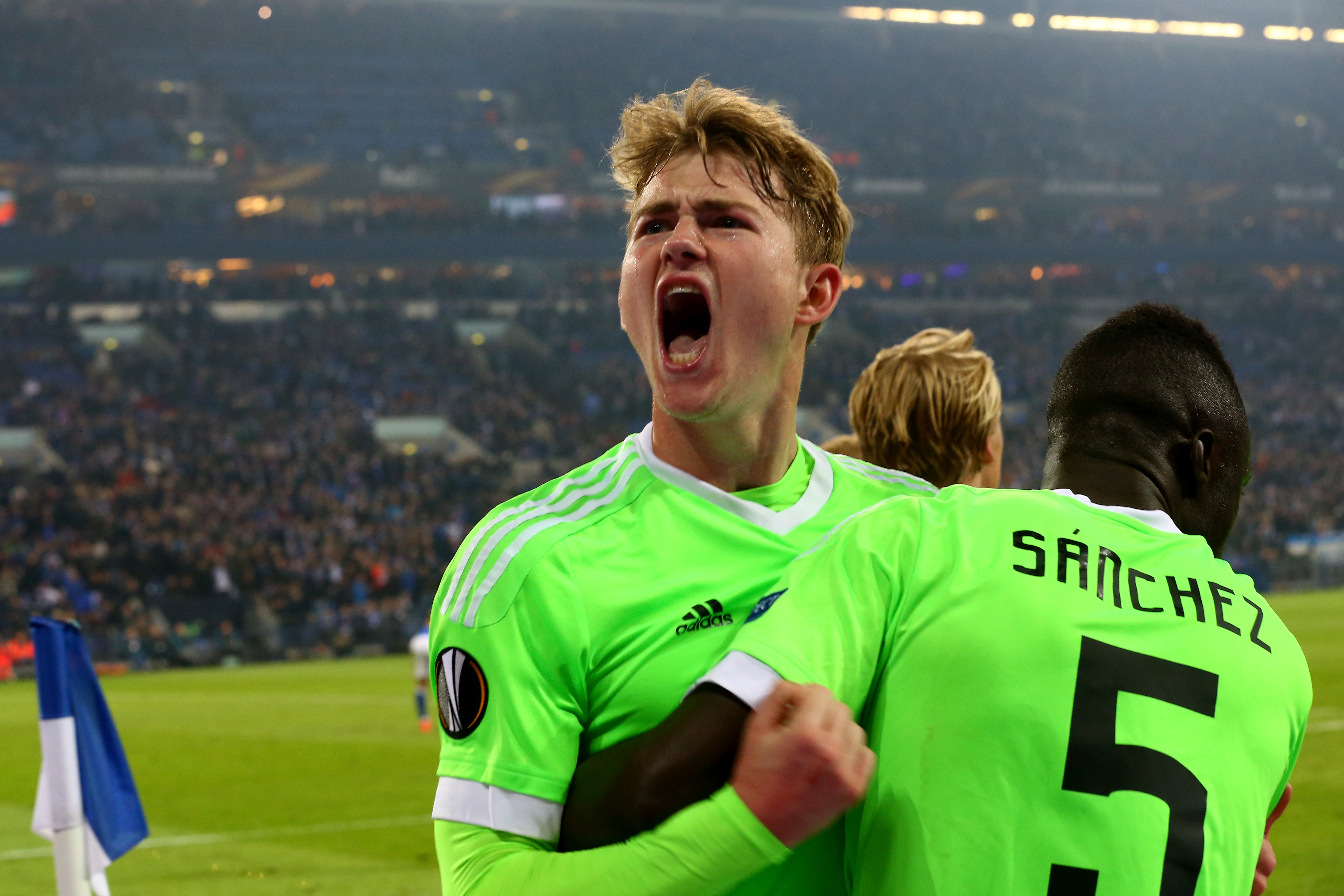 GELSENKIRCHEN, GERMANY - APRIL 20: (L-R) Matthijs de Ligt and Davinson Sanchez of Amsterdam celebrate the second goal with Davy Klaassen of Amsterdam (L) during the UEFA Europa League quarter final second leg match between FC Schalke 04 and Ajax Amsterdam at Veltins-Arena on April 20, 2017 in Gelsenkirchen, Germany.  (Photo by Christof Koepsel/Bongarts/Getty Images)