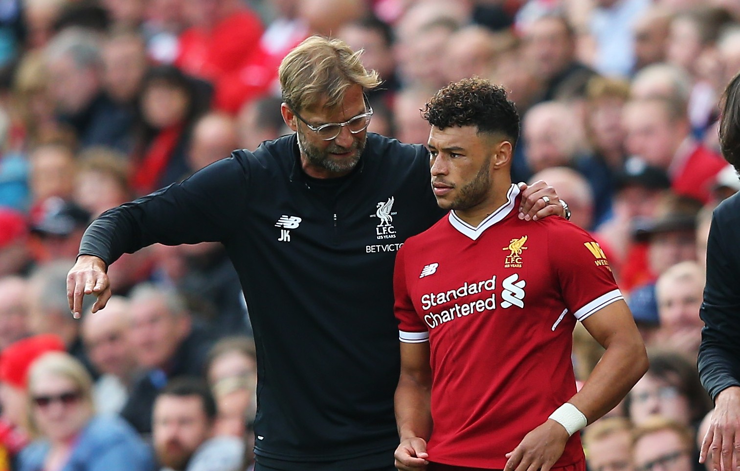 LIVERPOOL, ENGLAND - SEPTEMBER 16: Jurgen Klopp, Manager of Liverpool speaks to Alex Oxlade-Chamberlain of Liverpool before he comes on during the Premier League match between Liverpool and Burnley at Anfield on September 16, 2017 in Liverpool, England.  (Photo by Alex Livesey/Getty Images)