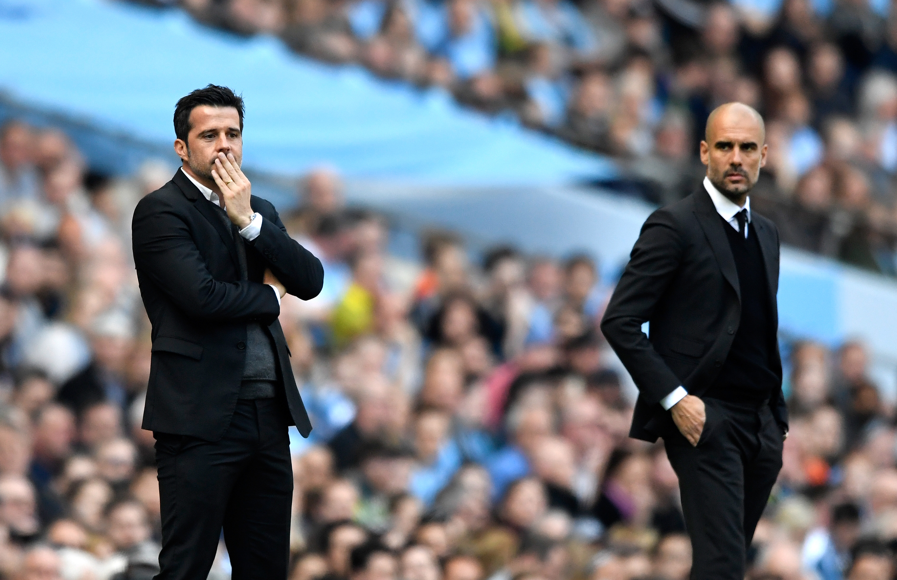 MANCHESTER, ENGLAND - APRIL 08: Marco Silva, Manager of Hull City (L) and Josep Guardiola, Manager of Manchester City (R) look on during the Premier League match between Manchester City and Hull City at Etihad Stadium on April 8, 2017 in Manchester, England.  (Photo by Stu Forster/Getty Images)