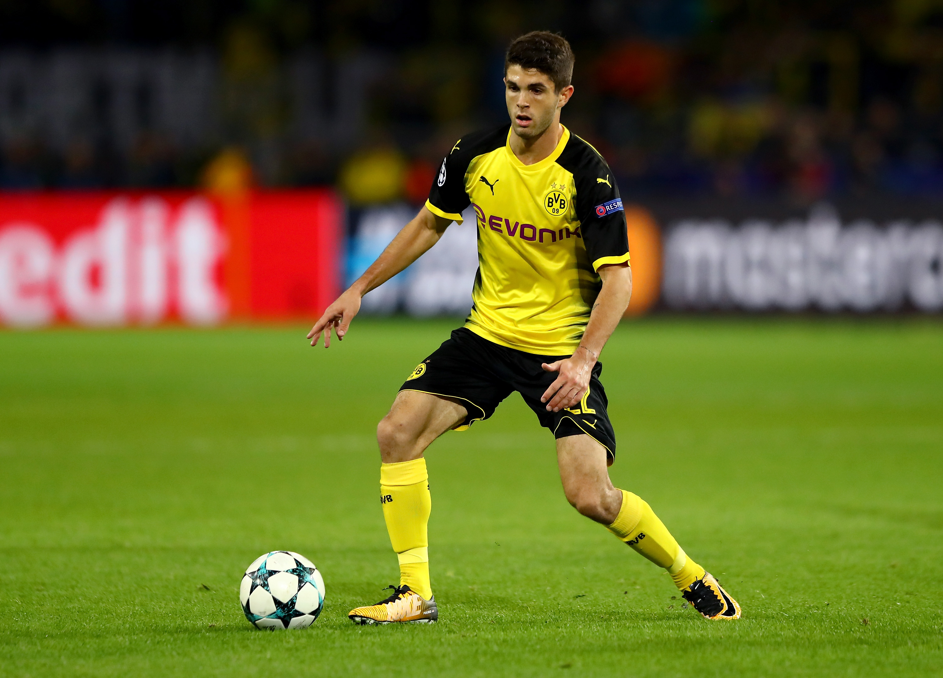 DORTMUND, GERMANY - SEPTEMBER 26:  Christian Pulisic of Dortmund runs with the ball the ball during the UEFA Champions League group H match between Borussia Dortmund and Real Madrid at Signal Iduna Park on September 26, 2017 in Dortmund, Germany.  (Photo by Martin Rose/Bongarts/Getty Images)