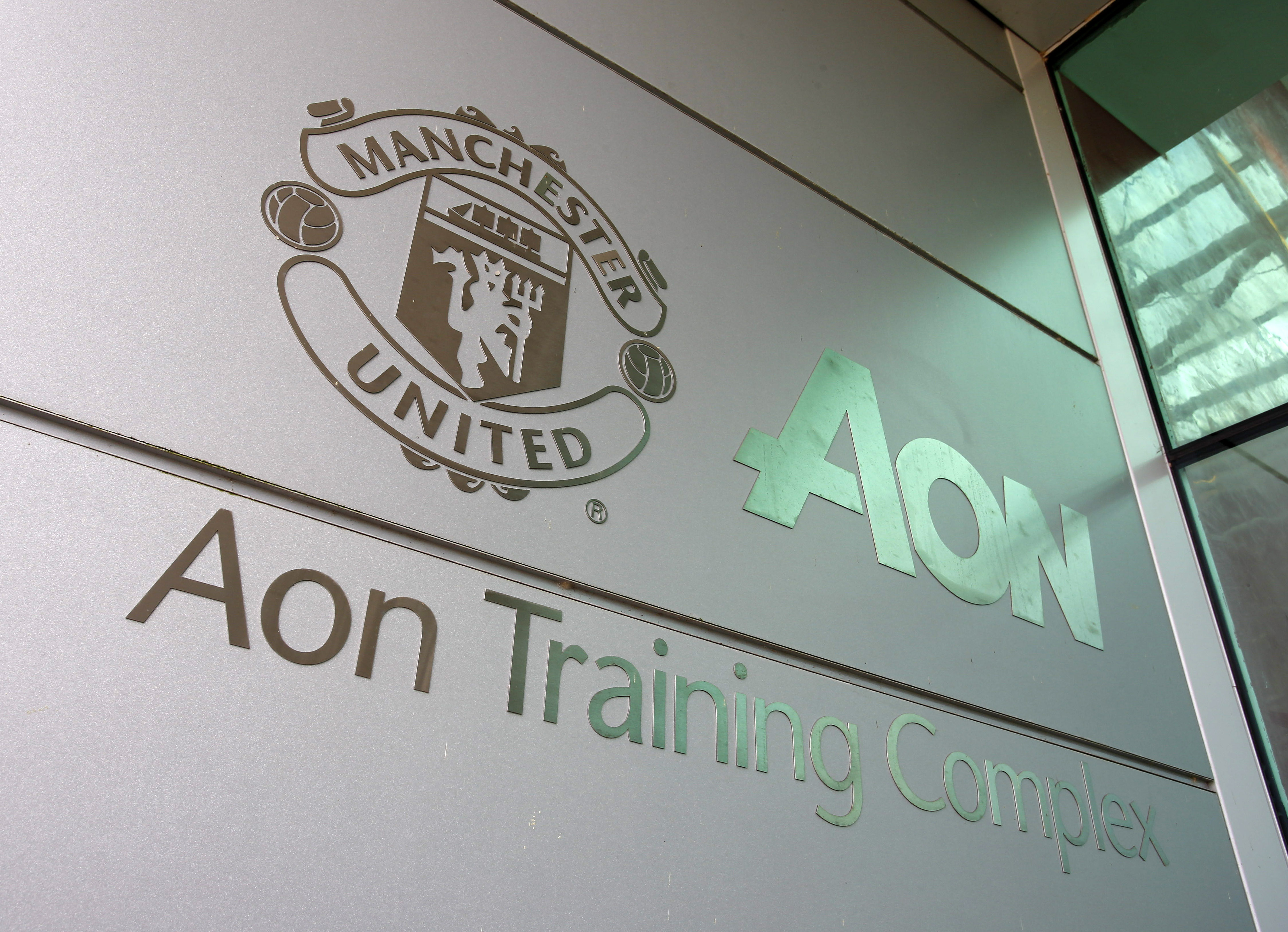Branding on the outside of Manchester United's AON Carrington Training Centre is pictured in Manchester, north west England on February 24, 2016. / AFP / LINDSEY PARNABY        (Photo credit should read LINDSEY PARNABY/AFP/Getty Images)