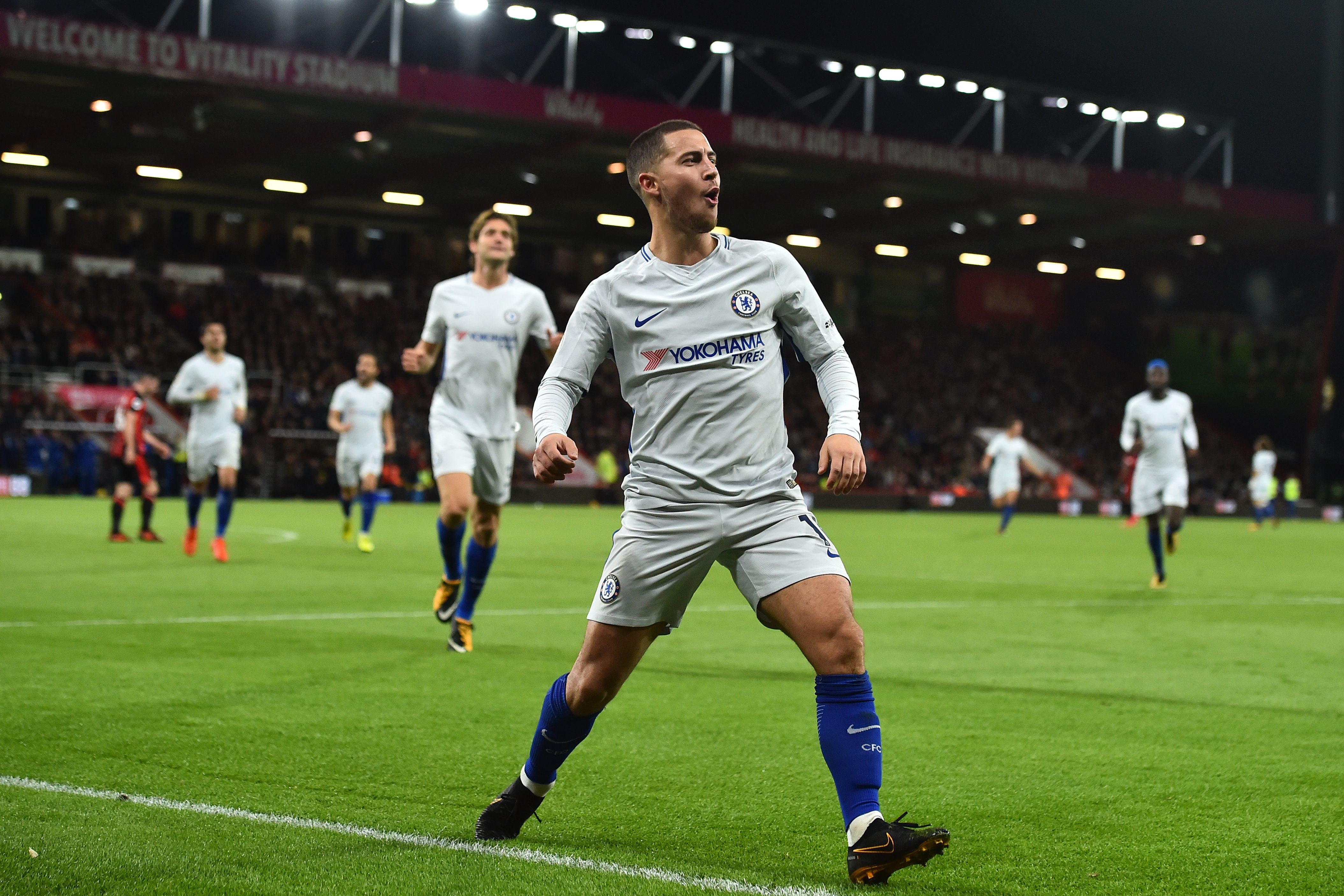 Chelsea's Belgian midfielder Eden Hazard celebrates after scoring the opening goal of the English Premier League football match between Bournemouth and Chelsea at the Vitality Stadium in Bournemouth, southern England on October 28, 2017. / AFP PHOTO / Glyn KIRK / RESTRICTED TO EDITORIAL USE. No use with unauthorized audio, video, data, fixture lists, club/league logos or 'live' services. Online in-match use limited to 75 images, no video emulation. No use in betting, games or single club/league/player publications.  /         (Photo credit should read GLYN KIRK/AFP/Getty Images)