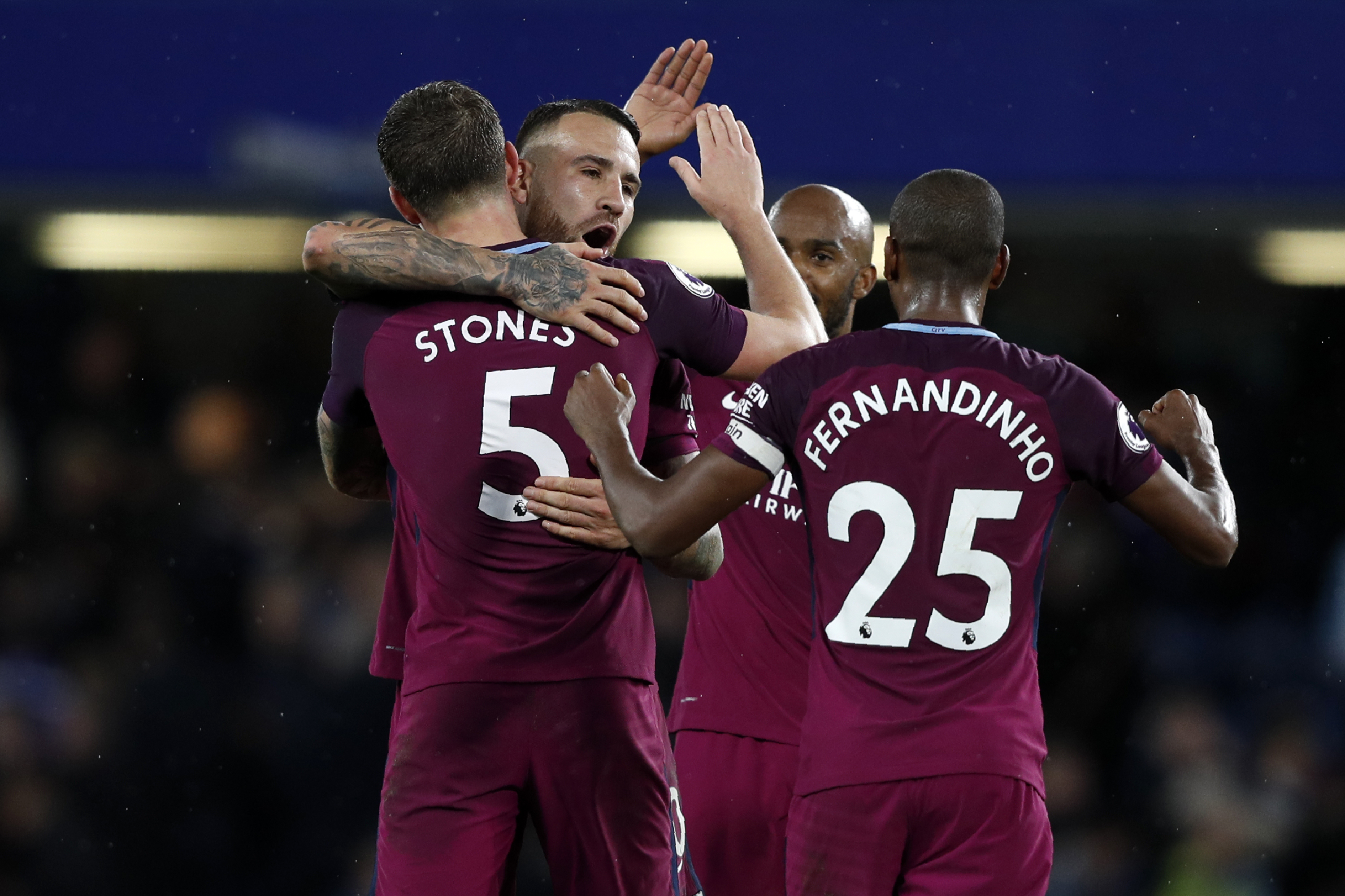 Manchester City's players celebrate on the pitch after during the English Premier League football match between Chelsea and Manchester City at Stamford Bridge in London on September 30, 2017.
Manchester City won the game 1-0. / AFP PHOTO / Adrian DENNIS / RESTRICTED TO EDITORIAL USE. No use with unauthorized audio, video, data, fixture lists, club/league logos or 'live' services. Online in-match use limited to 75 images, no video emulation. No use in betting, games or single club/league/player publications.  /         (Photo credit should read ADRIAN DENNIS/AFP/Getty Images)