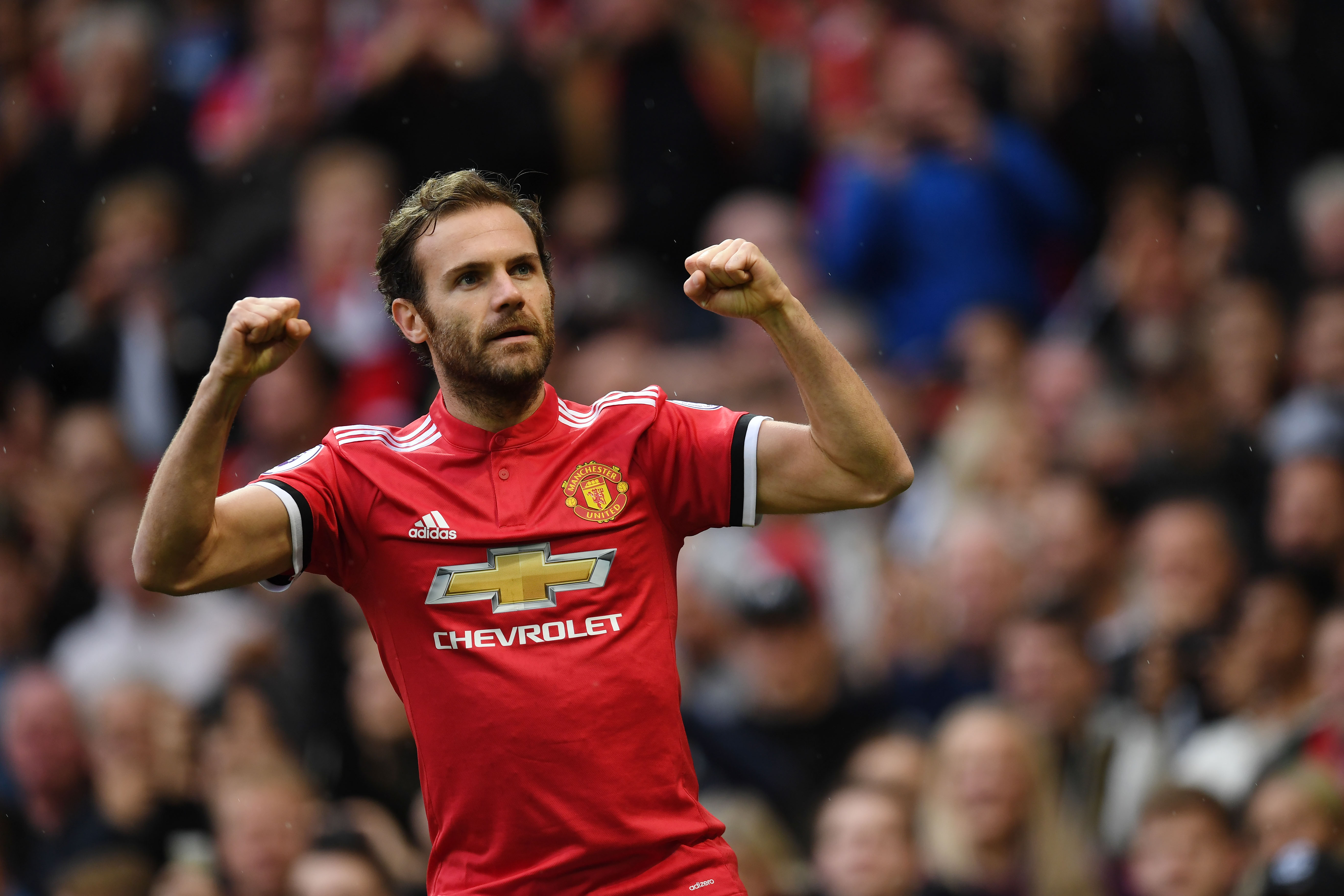 Manchester United's Spanish midfielder Juan Mata celebrates scoring the team's first goal during the English Premier League football match between Manchester United and Crystal Palace at Old Trafford in Manchester, north west England, on September 30, 2017. / AFP PHOTO / Paul ELLIS / RESTRICTED TO EDITORIAL USE. No use with unauthorized audio, video, data, fixture lists, club/league logos or 'live' services. Online in-match use limited to 75 images, no video emulation. No use in betting, games or single club/league/player publications.  /         (Photo credit should read PAUL ELLIS/AFP/Getty Images)