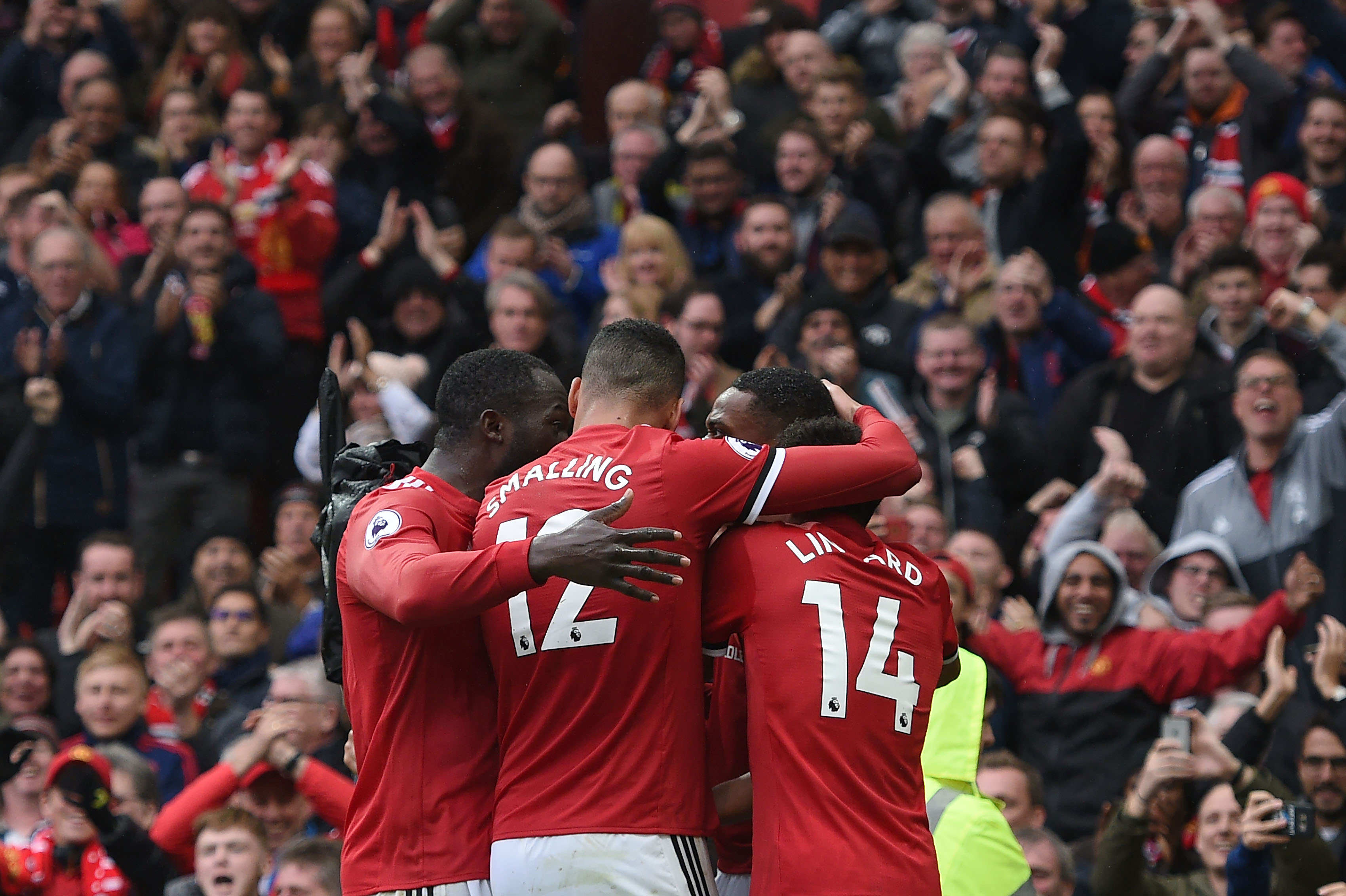 Manchester United's French striker Anthony Martial (2nd R) celebrates with teammates after scoring the opening goal of the English Premier League football match between Manchester United and Tottenham Hotspur at Old Trafford in Manchester, north west England, on October 28, 2017.
Manchester United won the game 1-0. / AFP PHOTO / Oli SCARFF / RESTRICTED TO EDITORIAL USE. No use with unauthorized audio, video, data, fixture lists, club/league logos or 'live' services. Online in-match use limited to 75 images, no video emulation. No use in betting, games or single club/league/player publications.  /         (Photo credit should read OLI SCARFF/AFP/Getty Images)