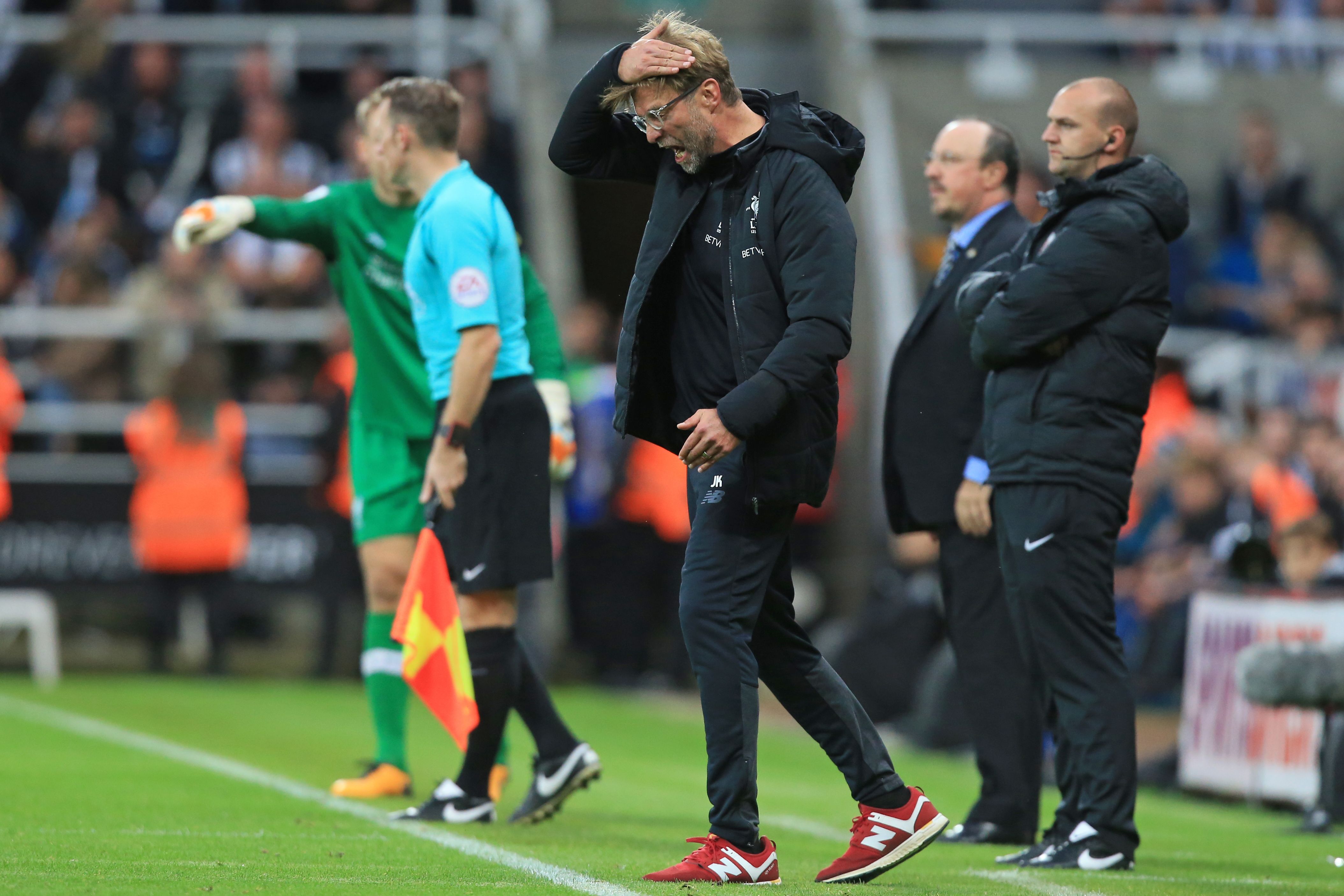 Liverpool's German manager Jurgen Klopp gestures on the touchline during the English Premier League football match between Newcastle United and Liverpool at St James' Park in Newcastle-upon-Tyne, north east England on October 1, 2017.
The game ended 1-1. / AFP PHOTO / Lindsey PARNABY / RESTRICTED TO EDITORIAL USE. No use with unauthorized audio, video, data, fixture lists, club/league logos or 'live' services. Online in-match use limited to 75 images, no video emulation. No use in betting, games or single club/league/player publications.  /         (Photo credit should read LINDSEY PARNABY/AFP/Getty Images)