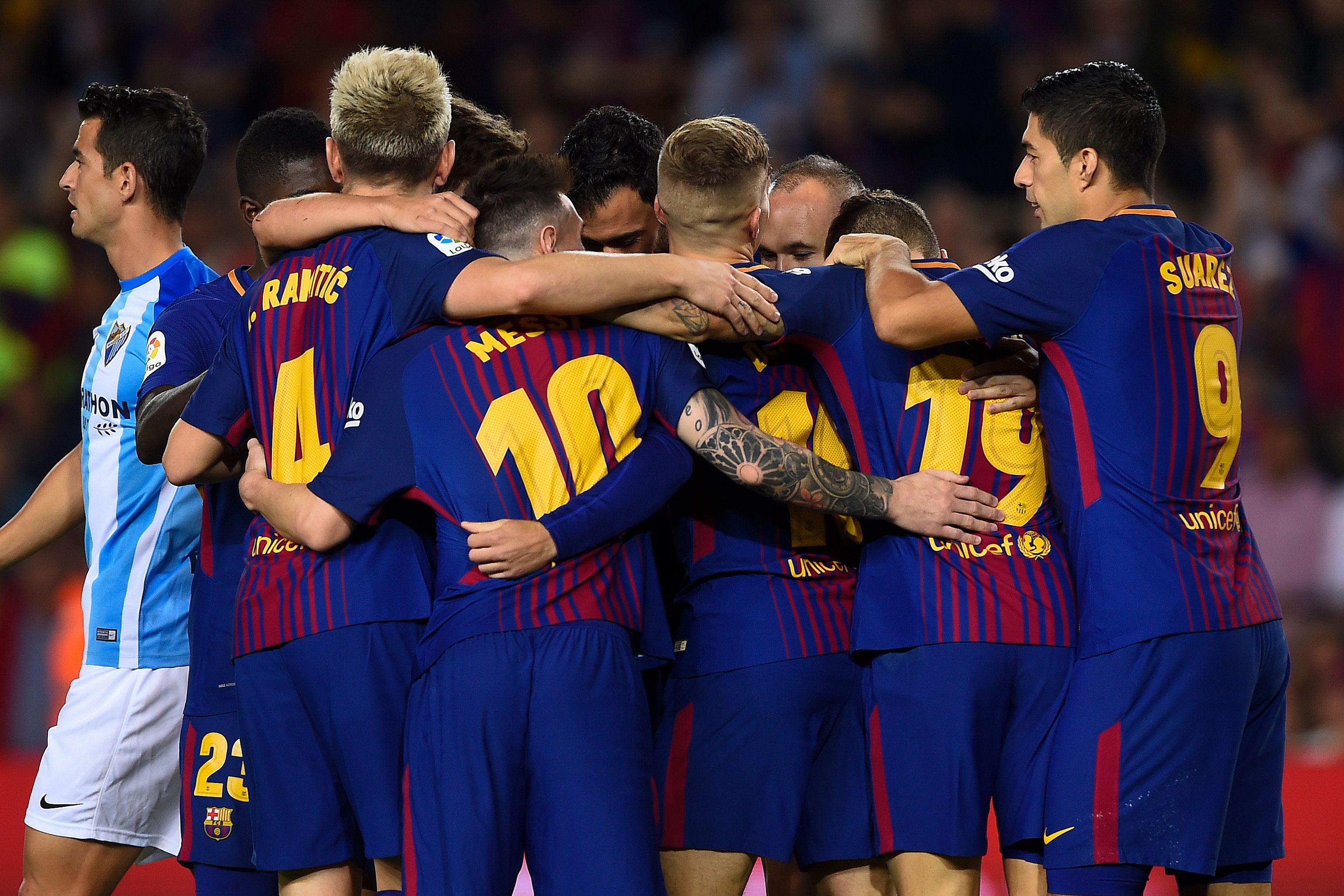 Barcelona's players celebrate a goal during the Spanish league football match FC Barcelona vs Malaga CF at the Camp Nou stadium in Barcelona on October 21, 2017. / AFP PHOTO / Josep LAGO        (Photo credit should read JOSEP LAGO/AFP/Getty Images)