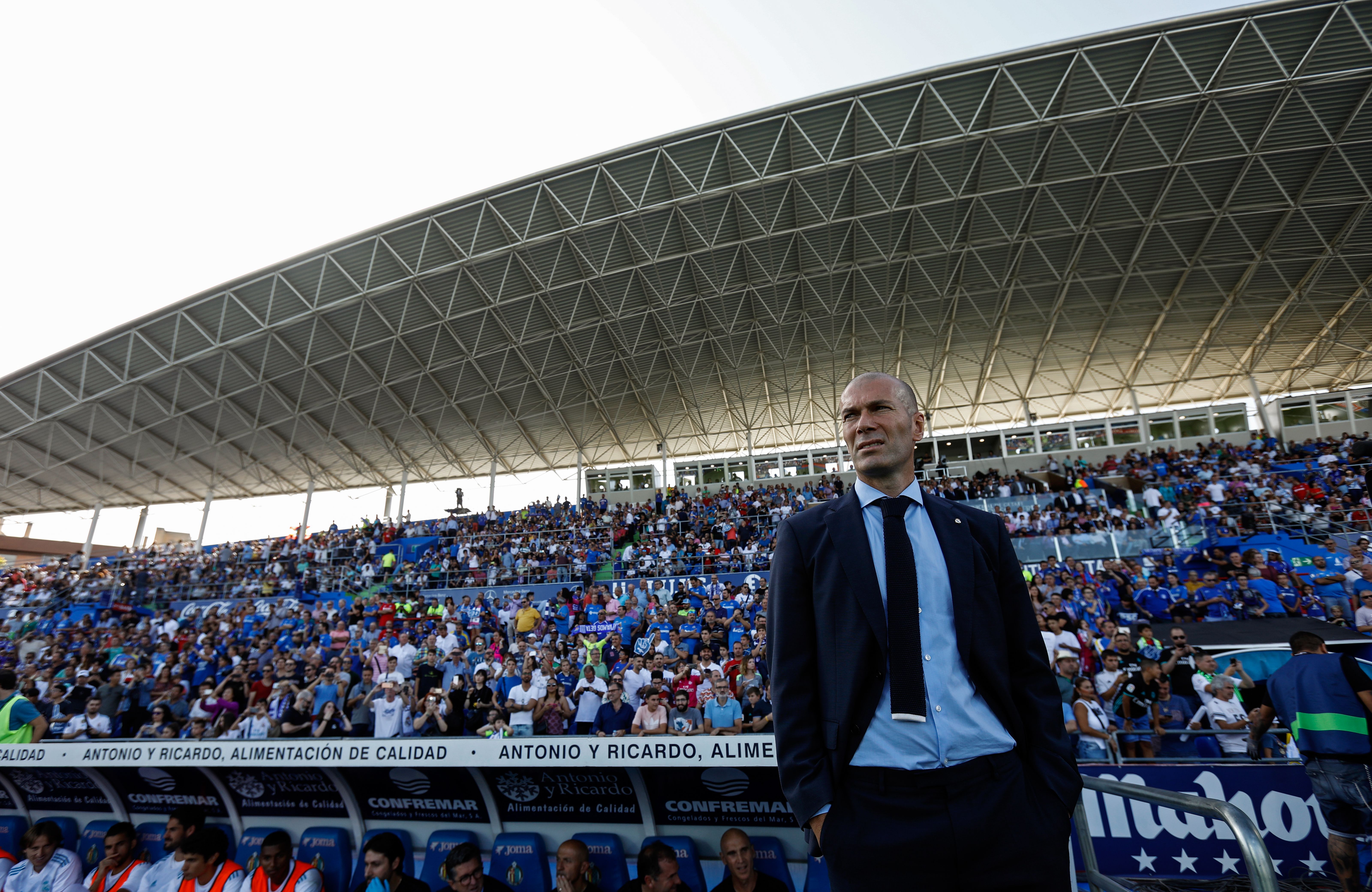 Real Madrid's French coach Zinedine Zidane stands on the sideline during the Spanish league football match Getafe CF vs Real Madrid CF at the Col. Alfonso Perez stadium in Getafe on October 14, 2017. / AFP PHOTO / OSCAR DEL POZO        (Photo credit should read OSCAR DEL POZO/AFP/Getty Images)