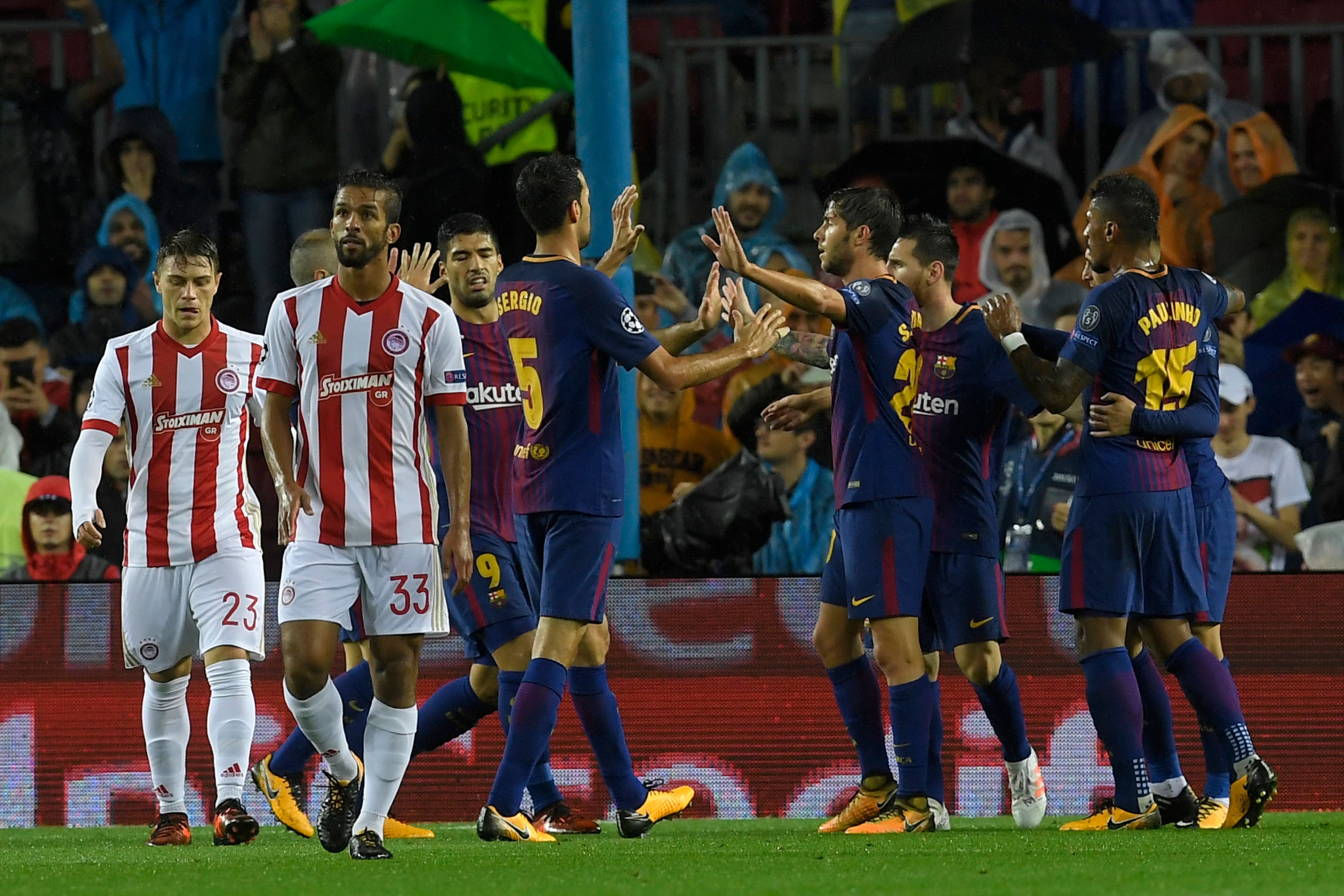Barcelona players celebrate a goal during the UEFA Champions League group D football match FC Barcelona vs Olympiacos FC at the Camp Nou stadium in Barcelona on Ocotber 18, 2017. / AFP PHOTO / LLUIS GENE        (Photo credit should read LLUIS GENE/AFP/Getty Images)