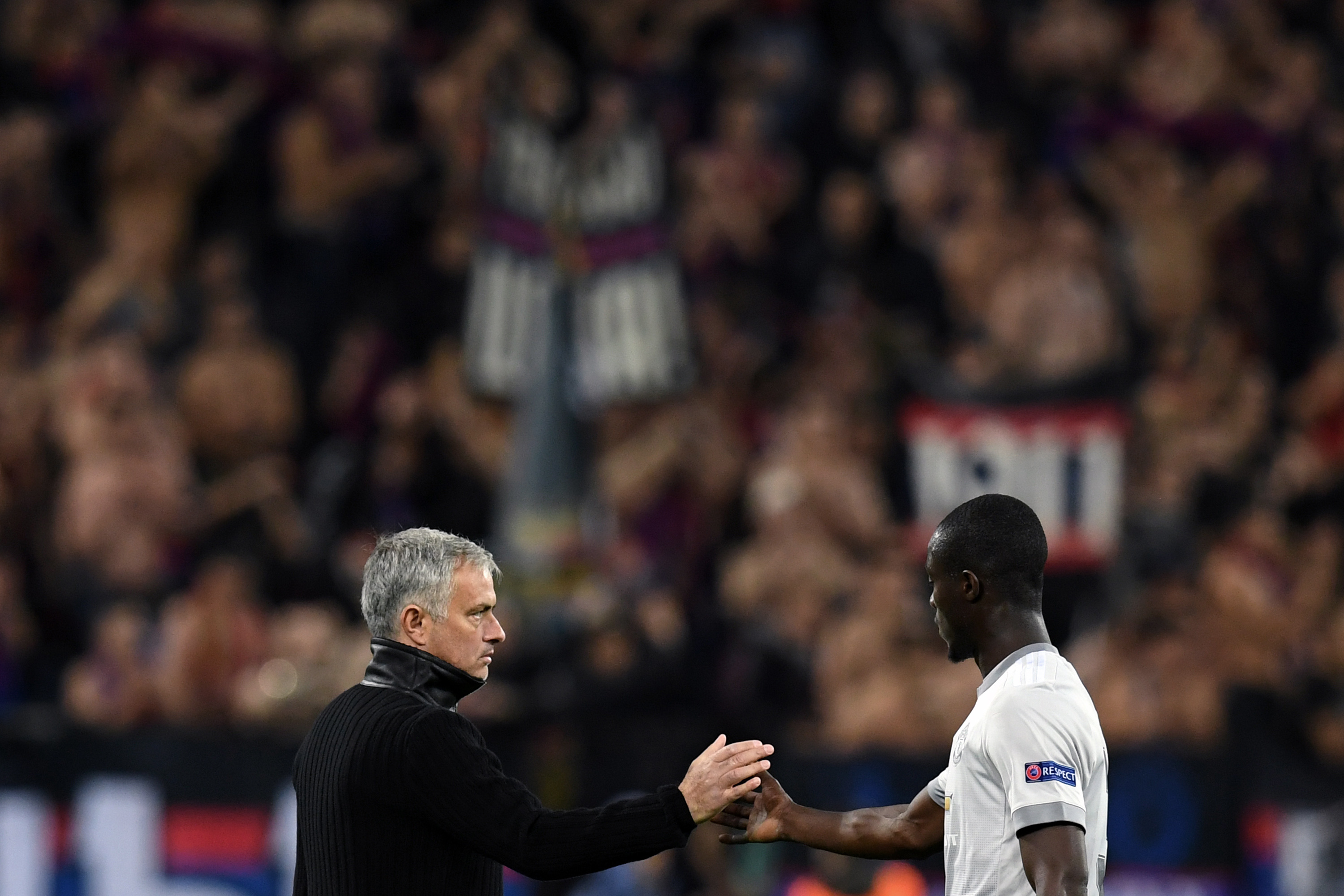 Manchester United's coach from Portugal Jose Mourinho thanks Manchester United's defender from Ivory Coast Eric Bailly after the UEFA Champions League Group A football match between PFC CSKA Moscow and Manchester United FC in Moscow on September 27, 2017. / AFP PHOTO / Kirill KUDRYAVTSEV        (Photo credit should read KIRILL KUDRYAVTSEV/AFP/Getty Images)