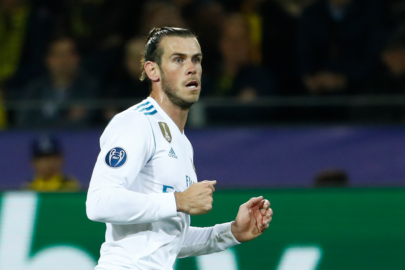 Real Madrid's forward from Wales Gareth Bale celebrates scoring the opening goal  during the UEFA Champions League Group H football match BVB Borussia Dortmund v Real Madrid in Dortmund, western Germany on September 26, 2017. / AFP PHOTO / Odd ANDERSEN        (Photo credit should read ODD ANDERSEN/AFP/Getty Images)
