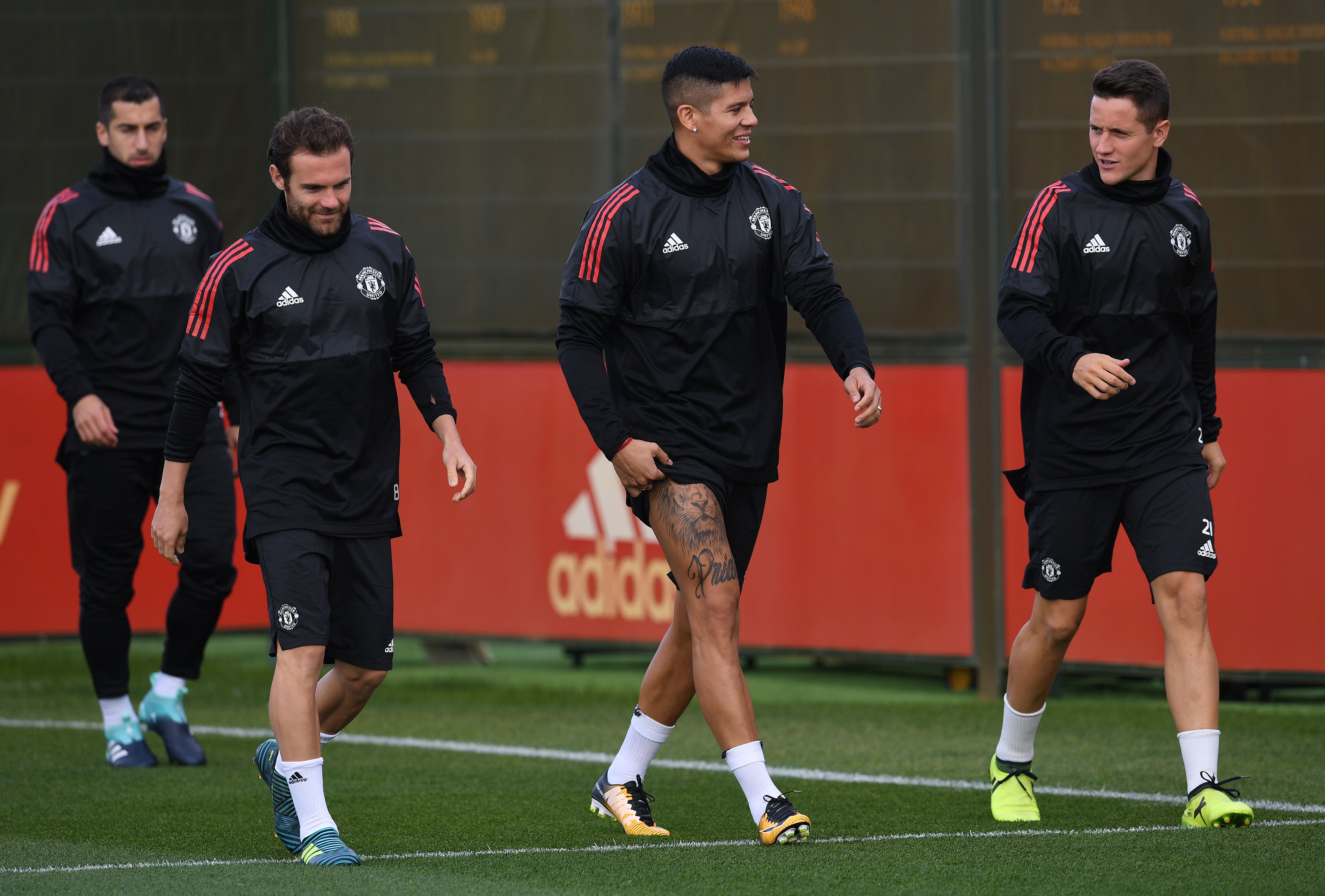 Manchester United's Armenian midfielder Henrikh Mkhitaryan (L), Manchester United's Spanish midfielder Juan Mata (2L), Manchester United's Argentinian defender Marcos Rojo  and Manchester United's Spanish midfielder Ander Herrera attends a team training session at the club's training complex near Carrington, west of Manchester in north west England on September 11, 2017, on the eve of their UEFA Champions League Group A football match against FC Basel. / AFP PHOTO / Paul ELLIS        (Photo credit should read PAUL ELLIS/AFP/Getty Images)