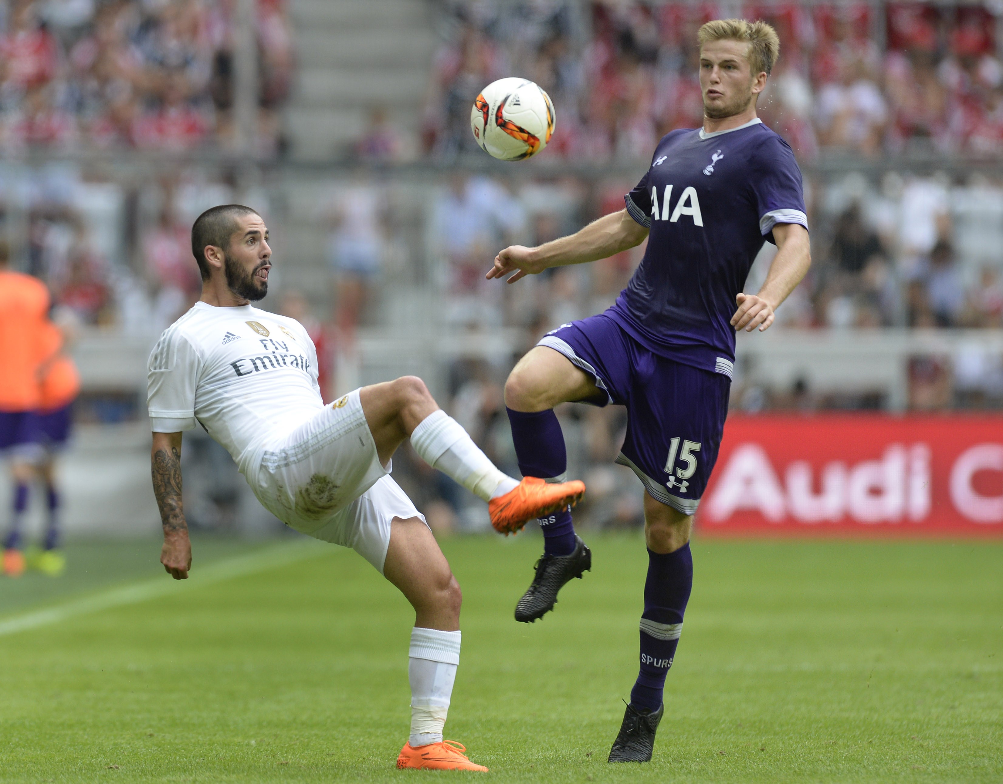 Real Madrid's midfielder Isco (L) and Tottenham's defender Eric Dier  vie for the ball during the Audi Cup football match Real Madrid vs Tottenham Hotspur in Munich, southern Germany, on August 4, 2015. The Audi Cup football matches with Bayern Munich of Germany, Real Madrid of Spain, AC Milan of Italy and Tottenham Hotspur of England will take place in Munich on August 4 and August 5, 2015. AFP PHOTO / CHRISTOF STACHE        (Photo credit should read CHRISTOF STACHE/AFP/Getty Images)