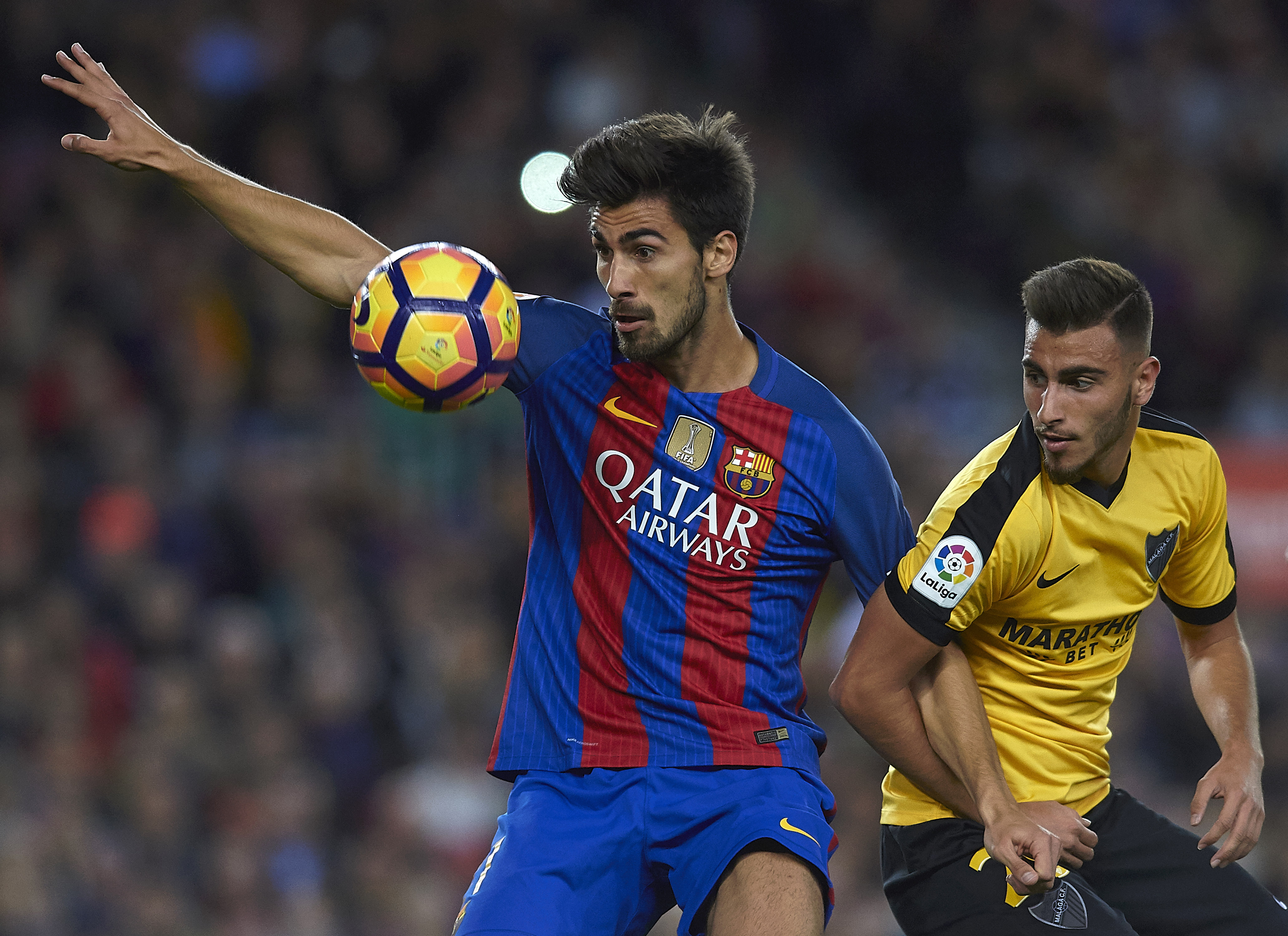 BARCELONA, SPAIN - NOVEMBER 19:  Andre Gomes of Barcelona competes for the ball with Juankar (R) of Malaga during the La Liga match between FC Barcelona and Malaga CF at Camp Nou stadium on November 19, 2016 in Barcelona, Spain.  (Photo by Manuel Queimadelos Alonso/Getty Images)