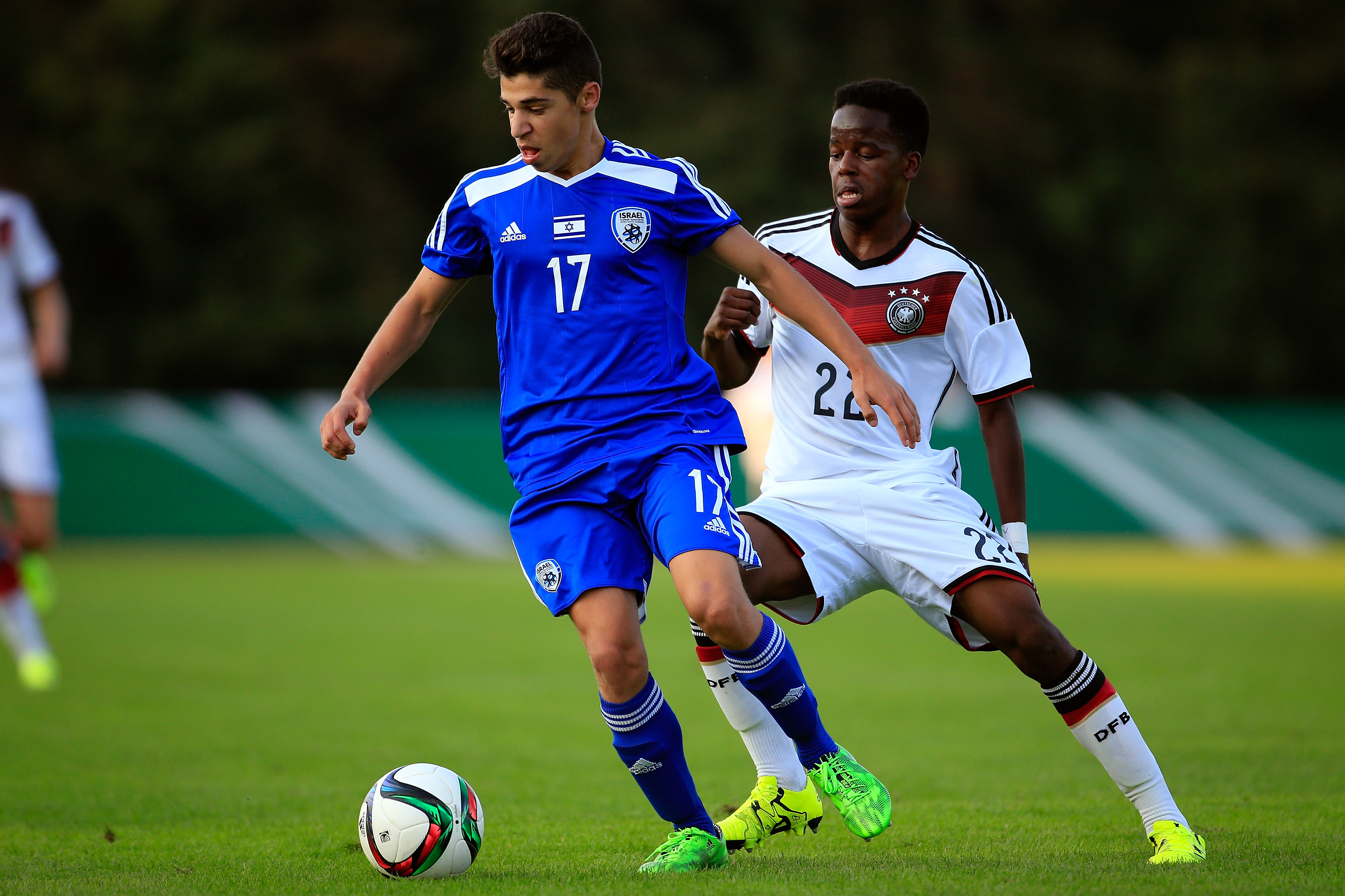 BREMEN, GERMANY - SEPTEMBER 11:  Alfons Amade of U17 Germany  challenges Manor Solomon  of U17 Israel during the match between U17 Germany v U17 Israel at BZA Obervieland on September 11, 2015 in Bremen, Germany.  (Photo by Martin Stoever/Bongarts/Getty Images)
