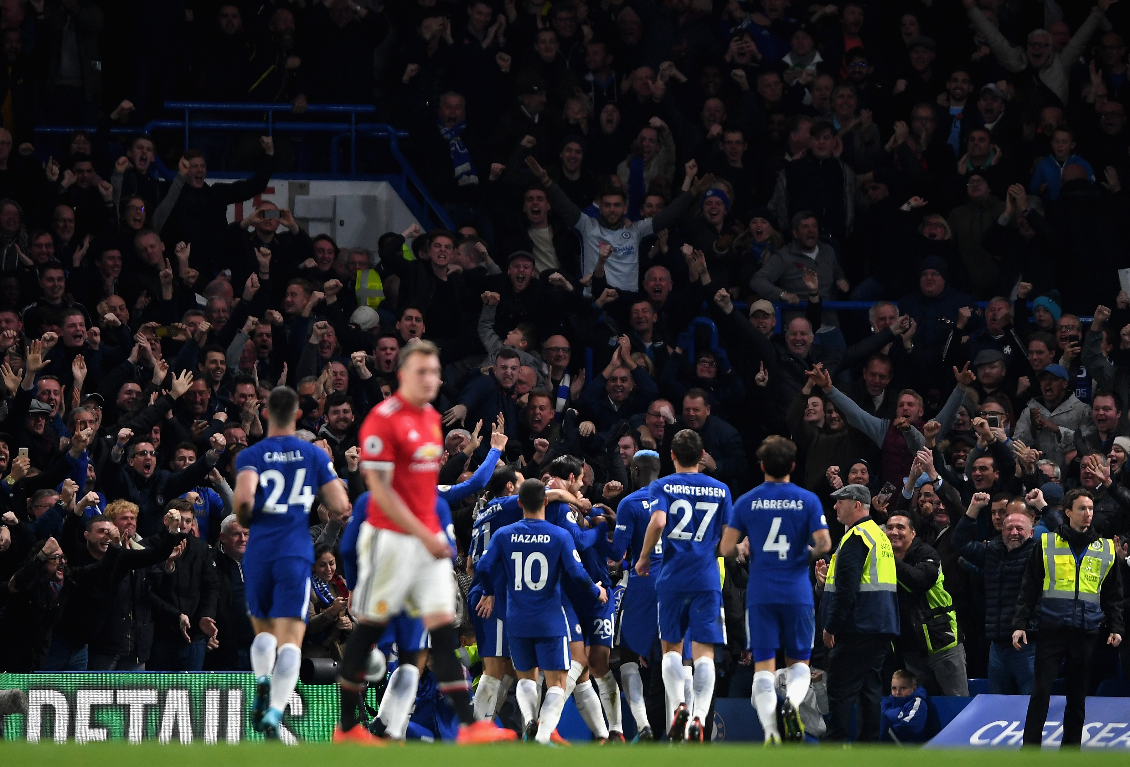 LONDON, ENGLAND - NOVEMBER 05: Alvaro Morata of Chelsea (obscure) celebrates scoring his sides first goal with his team mates during the Premier League match between Chelsea and Manchester United at Stamford Bridge on November 5, 2017 in London, England.  (Photo by Mike Hewitt/Getty Images)