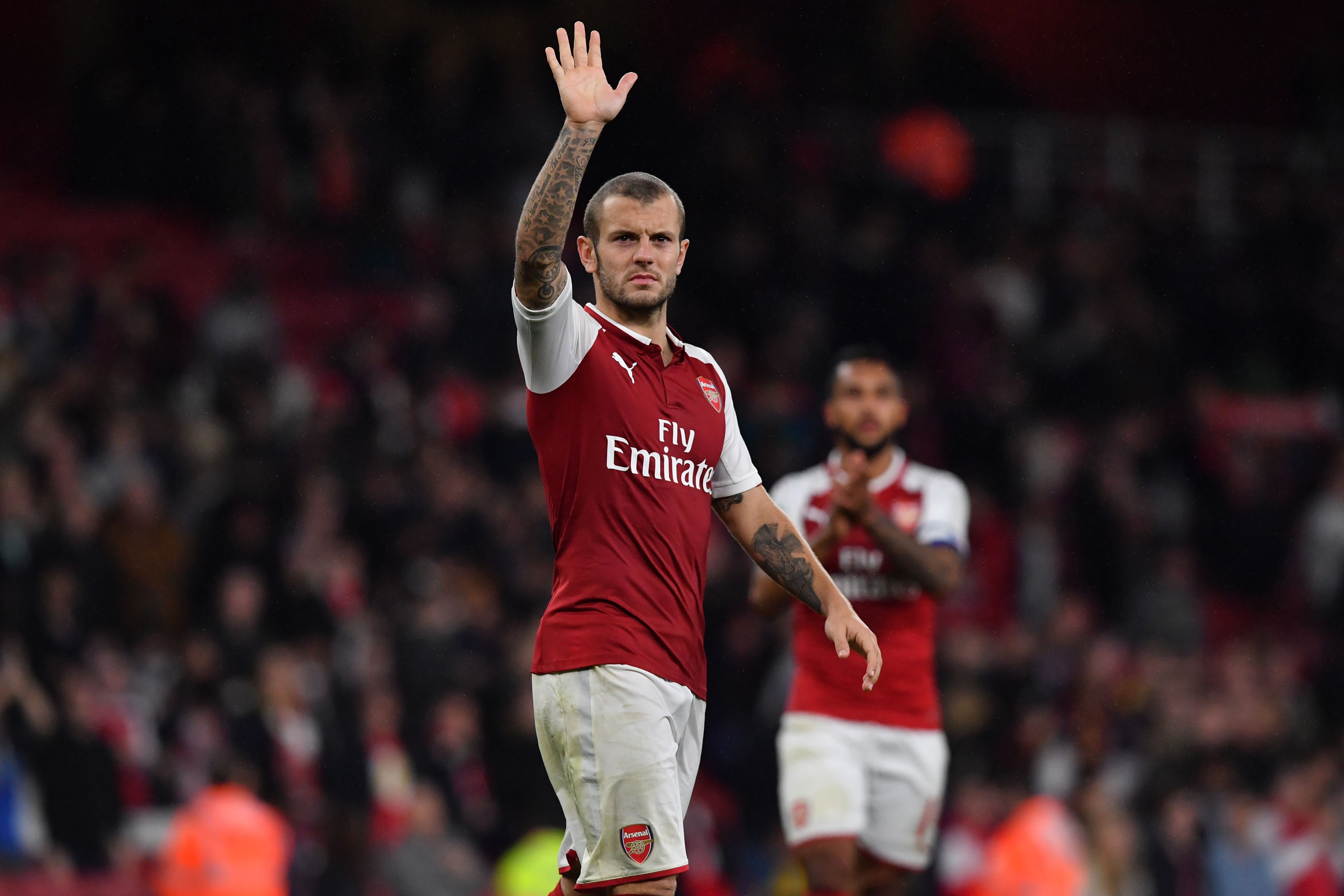 Arsenal's English midfielder Jack Wilshere gestures to supporters on the pitch after the English League Cup fourth round football match between Arsenal and Norwich City at The Emirates Stadium in London on October 24, 2017.
Arsenal won the game 2-1 after extra time after the game finished 1-1. / AFP PHOTO / Ben STANSALL / RESTRICTED TO EDITORIAL USE. No use with unauthorized audio, video, data, fixture lists, club/league logos or 'live' services. Online in-match use limited to 75 images, no video emulation. No use in betting, games or single club/league/player publications.  /         (Photo credit should read BEN STANSALL/AFP/Getty Images)