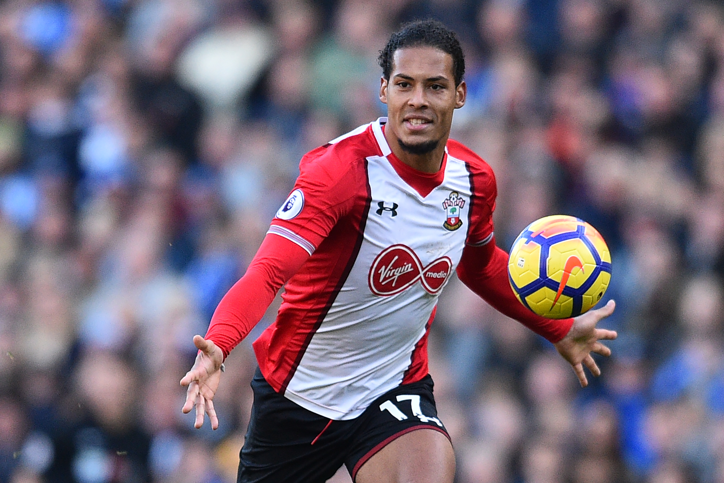 Southampton's Dutch defender Virgil van Dijk chases the ball during the English Premier League football match between Brighton and Hove Albion and Southampton at the American Express Community Stadium in Brighton, southern England on October 29, 2017. / AFP PHOTO / Glyn KIRK / RESTRICTED TO EDITORIAL USE. No use with unauthorized audio, video, data, fixture lists, club/league logos or 'live' services. Online in-match use limited to 75 images, no video emulation. No use in betting, games or single club/league/player publications.  /         (Photo credit should read GLYN KIRK/AFP/Getty Images)