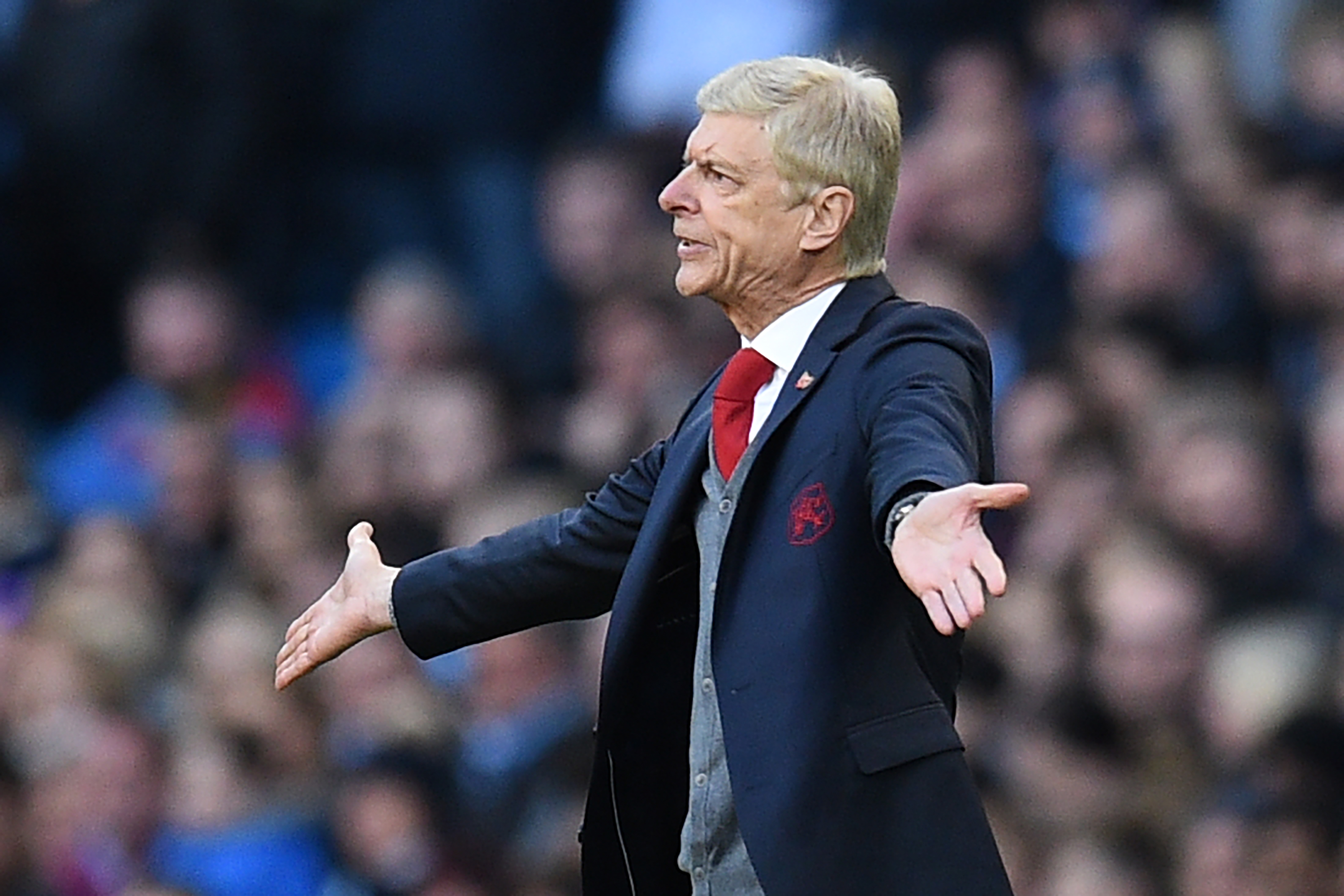 Arsenal's French manager Arsene Wenger gestures on the touchline during the English Premier League football match between Manchester City and Arsenal at the Etihad Stadium in Manchester, north west England, on November 5, 2017. / AFP PHOTO / Oli SCARFF / RESTRICTED TO EDITORIAL USE. No use with unauthorized audio, video, data, fixture lists, club/league logos or 'live' services. Online in-match use limited to 75 images, no video emulation. No use in betting, games or single club/league/player publications.  /         (Photo credit should read OLI SCARFF/AFP/Getty Images)
