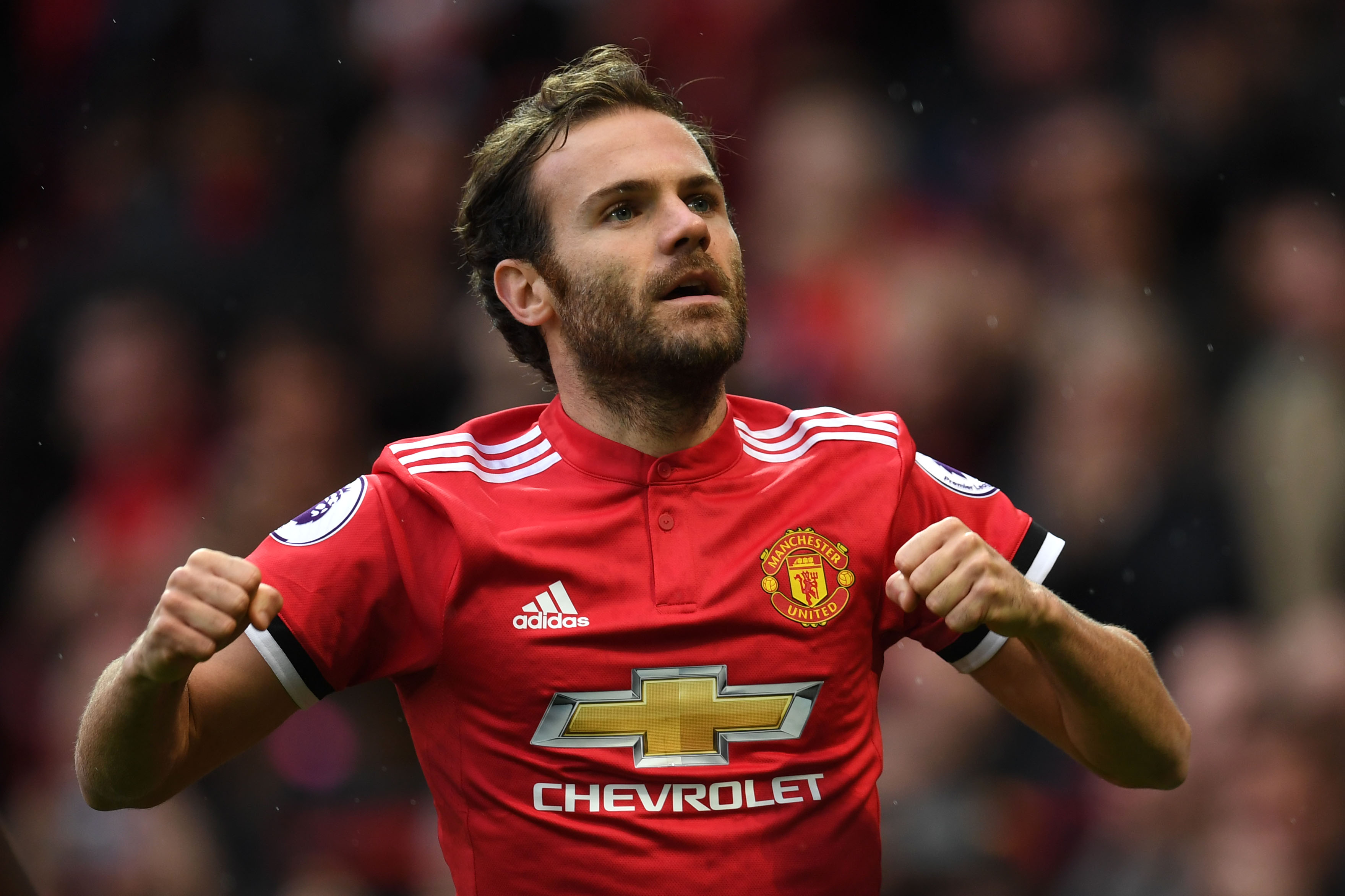Manchester United's Spanish midfielder Juan Mata celebrates scoring the team's first goal during the English Premier League football match between Manchester United and Crystal Palace at Old Trafford in Manchester, north west England, on September 30, 2017. / AFP PHOTO / Paul ELLIS / RESTRICTED TO EDITORIAL USE. No use with unauthorized audio, video, data, fixture lists, club/league logos or 'live' services. Online in-match use limited to 75 images, no video emulation. No use in betting, games or single club/league/player publications.  /         (Photo credit should read PAUL ELLIS/AFP/Getty Images)