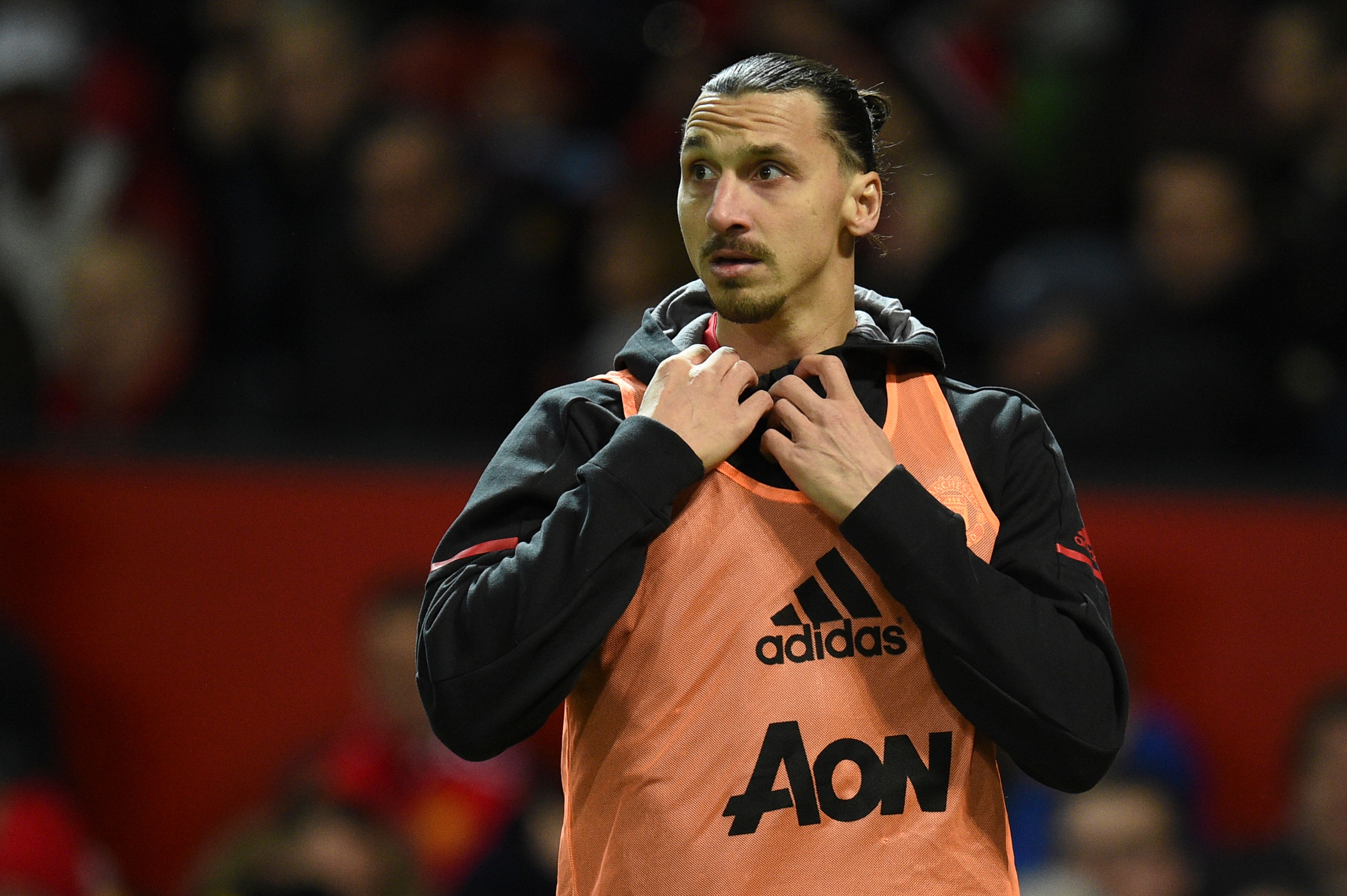 Manchester United's Swedish striker Zlatan Ibrahimovic warms up on the touchline during the English Premier League football match between Manchester United and Newcastle at Old Trafford in Manchester, north west England, on November 18, 2017. / AFP PHOTO / Oli SCARFF / RESTRICTED TO EDITORIAL USE. No use with unauthorized audio, video, data, fixture lists, club/league logos or 'live' services. Online in-match use limited to 75 images, no video emulation. No use in betting, games or single club/league/player publications.  /         (Photo credit should read OLI SCARFF/AFP/Getty Images)