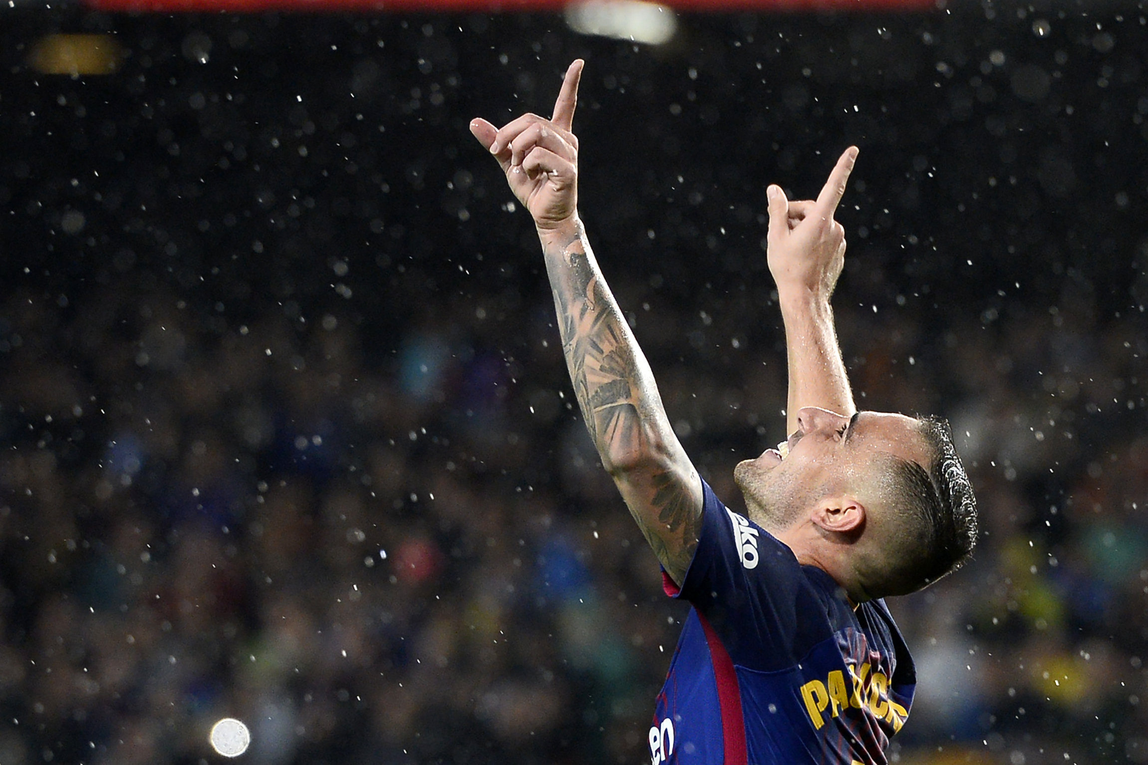 Barcelona's Spanish forward Paco Alcacer celebrates after scoring a goal during the Spanish league football match FC Barcelona vs Sevilla FC at the Camp Nou stadium in Barcelona on November 4, 2017. / AFP PHOTO / Josep LAGO        (Photo credit should read JOSEP LAGO/AFP/Getty Images)