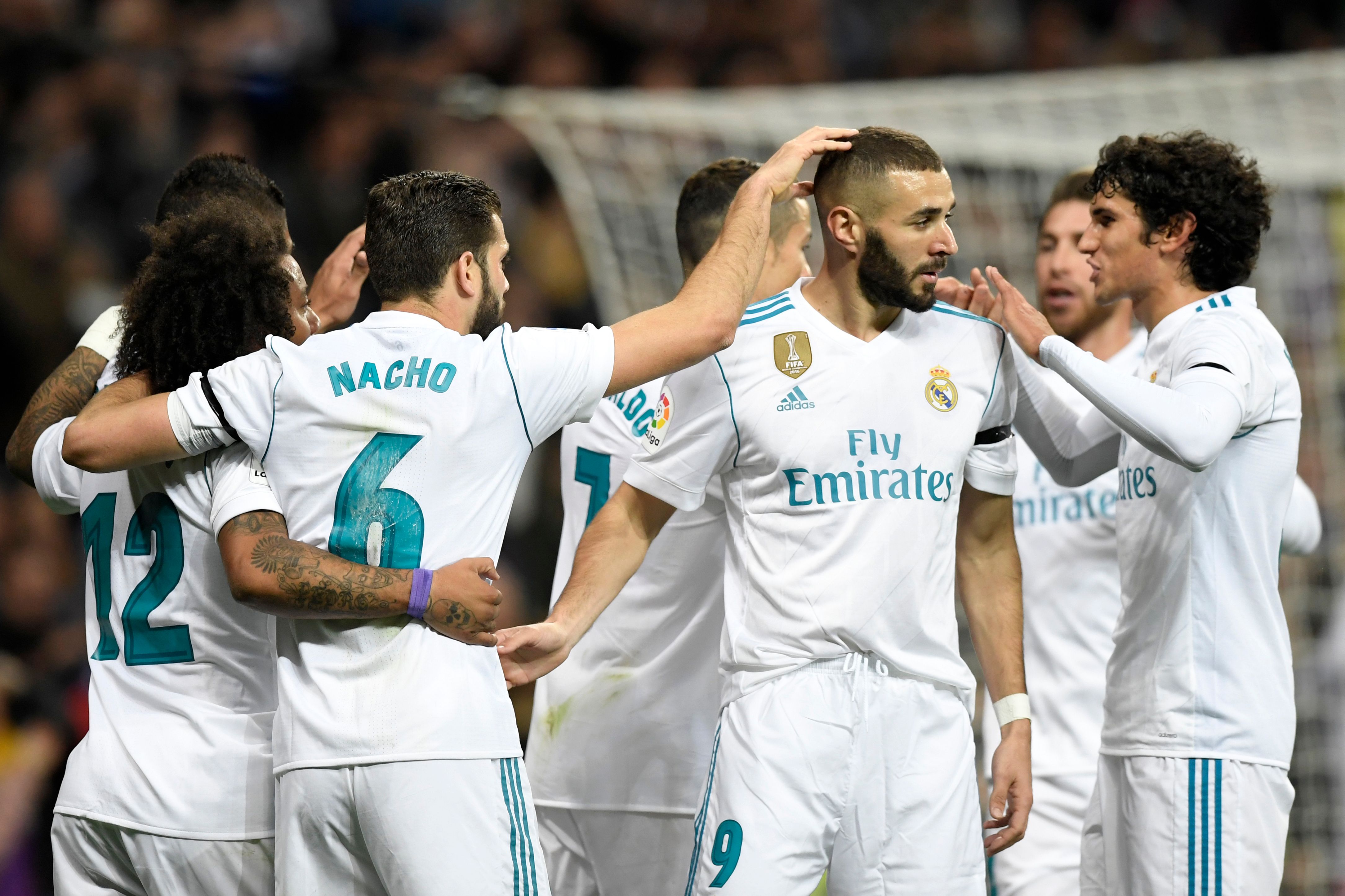 Real Madrid's players celebrate a goal during the Spanish league football match Real Madrid CF vs UD Las Palmas at the Santiago Bernabeu stadium in Madrid on November 5, 2017. / AFP PHOTO / GABRIEL BOUYS        (Photo credit should read GABRIEL BOUYS/AFP/Getty Images)