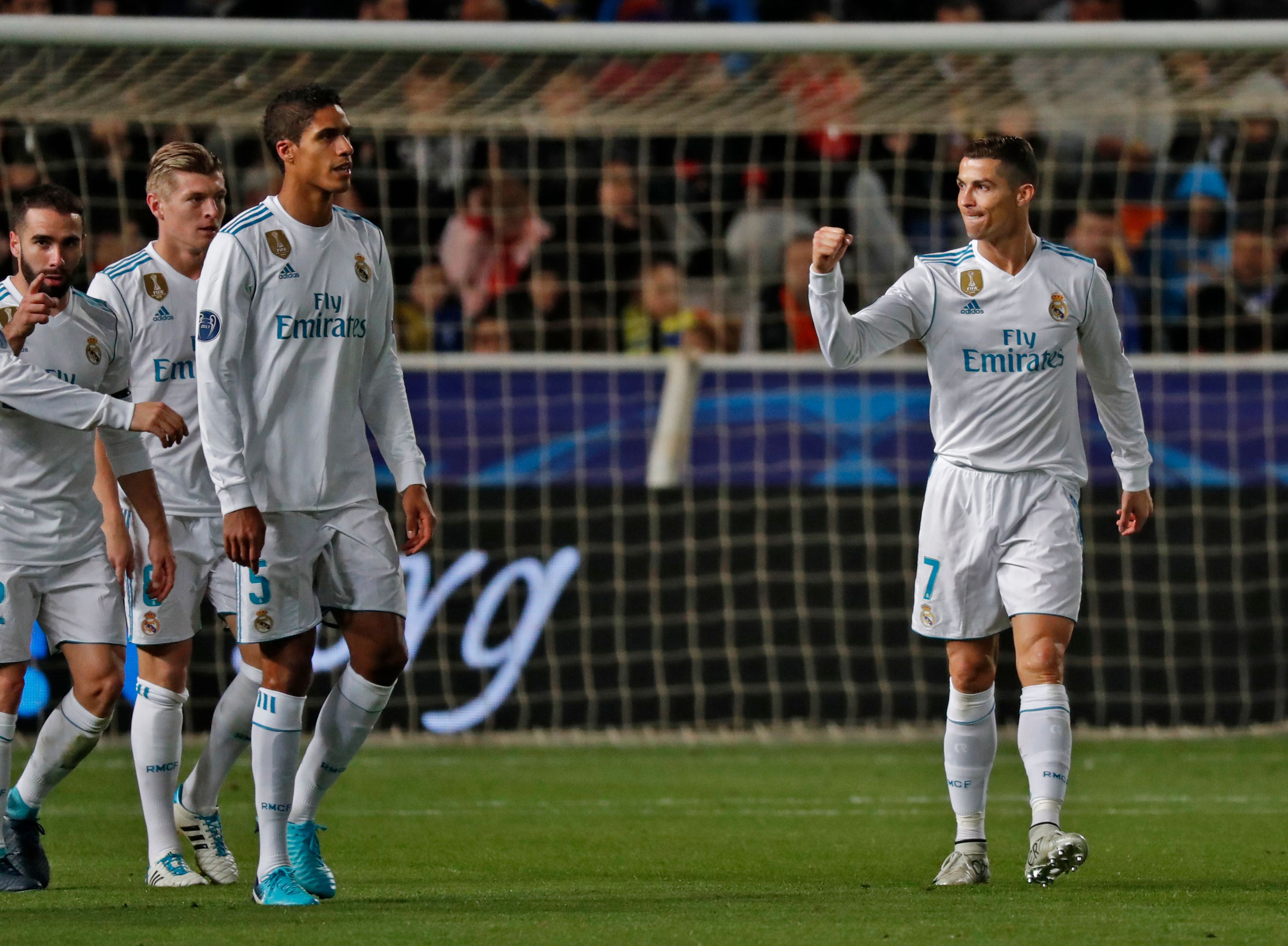 Real Madrid's Portuguese forward Cristiano Ronaldo (R) celebrates with teammates after scoring during the UEFA Champions League Group H match between Apoel FC and Real Madrid on November 21, 2017, in the Cypriot capital Nicosia's GSP Stadium.  / AFP PHOTO / Thomas COEX        (Photo credit should read THOMAS COEX/AFP/Getty Images)