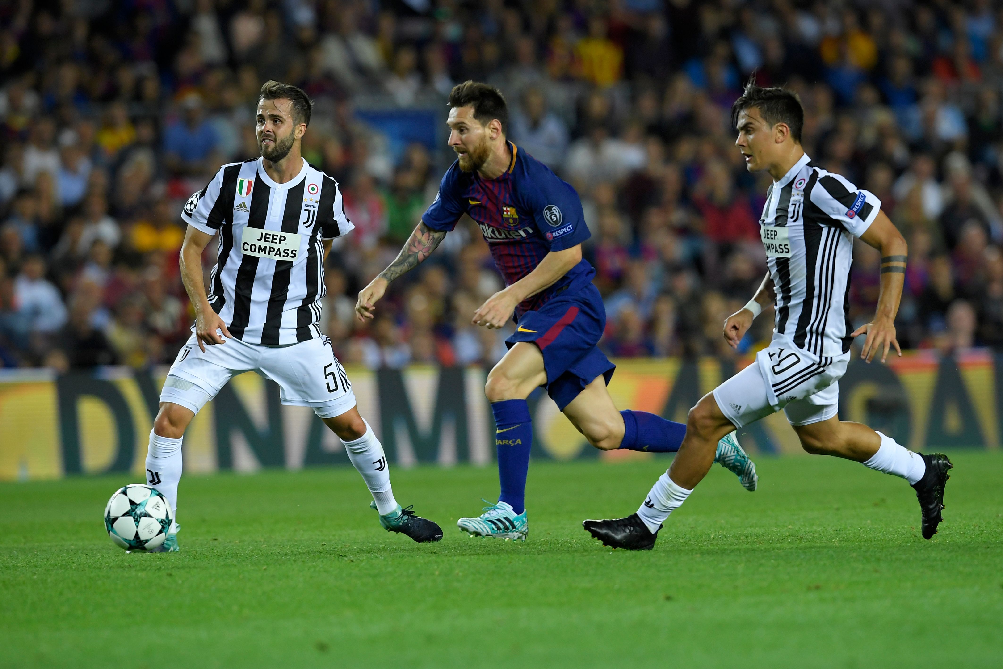 Barcelona's forward from Argentina Lionel Messi (C) vies with Juventus' midfielder from Bosnia-Herzegovina Miralem Pjanic (L) and Juventus' forward from Argentina Paulo Dybala during the UEFA Champions League Group D football match FC Barcelona vs Juventus at the Camp Nou stadium in Barcelona on September 12, 2017. / AFP PHOTO / LLUIS GENE        (Photo credit should read LLUIS GENE/AFP/Getty Images)